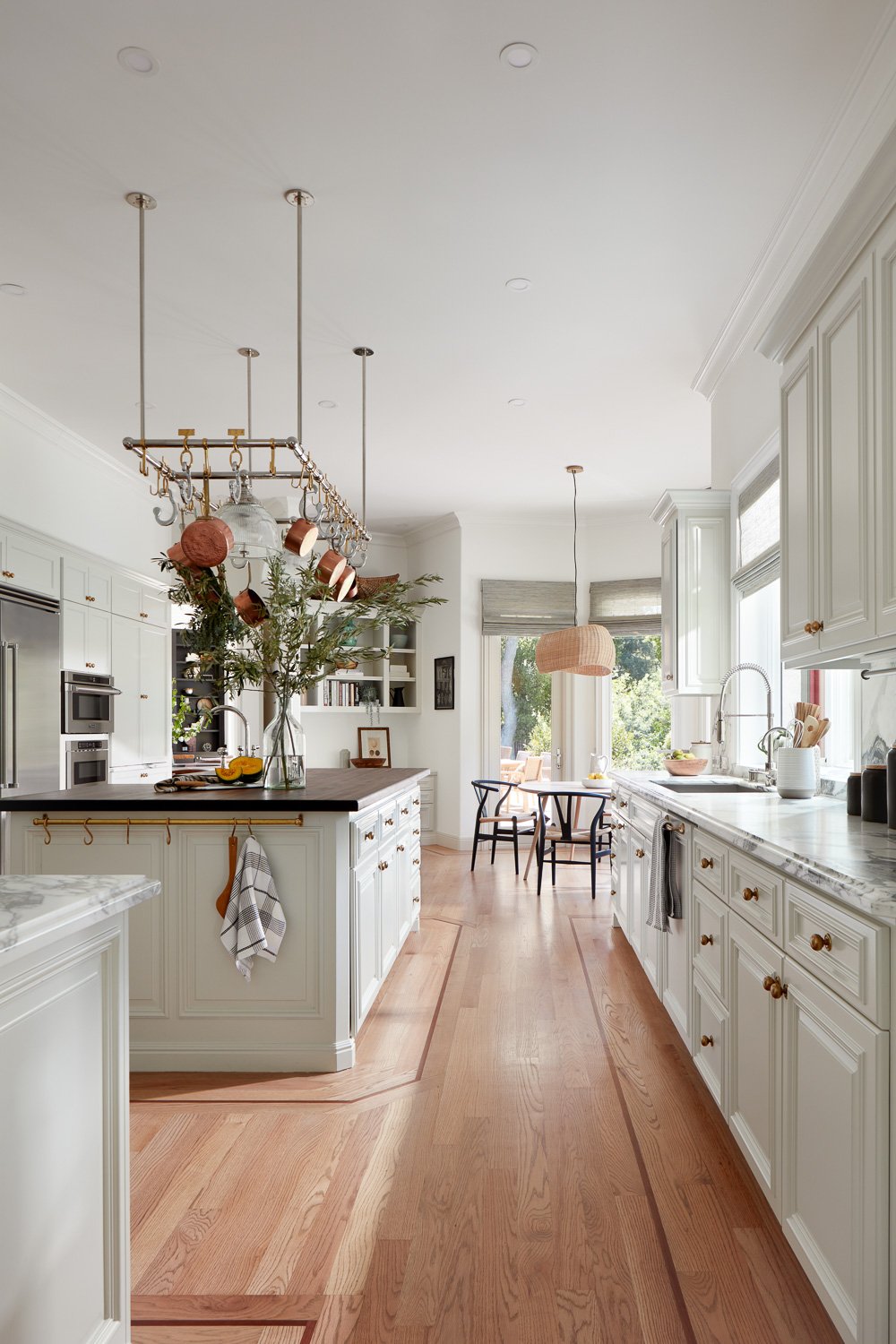 This is a high end Hamptons style kitchen design located in Atherton with an Ann Morris pot rack