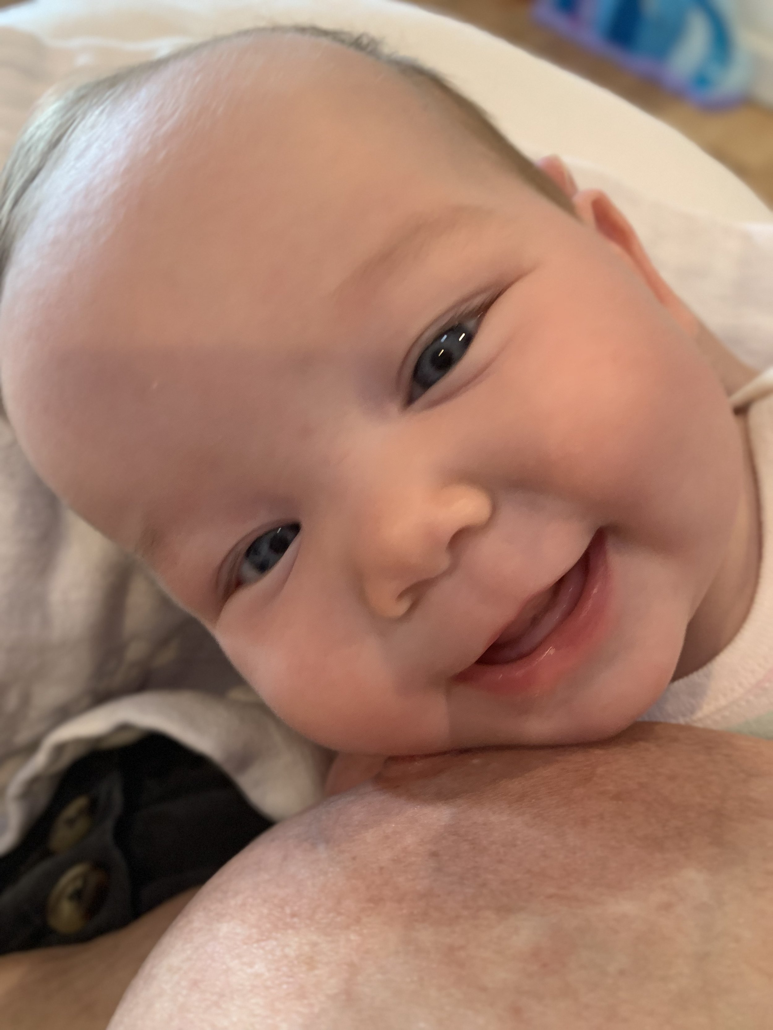 Emily Kaiser holding her youngest as a newborn