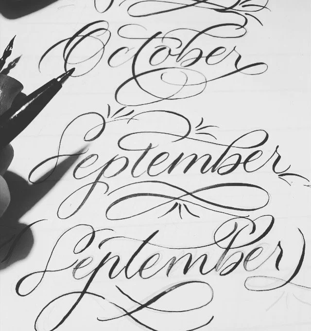 Calligraphy writing of the months 'October,' 'September,' and '(Septembre)' in black ink on white paper.