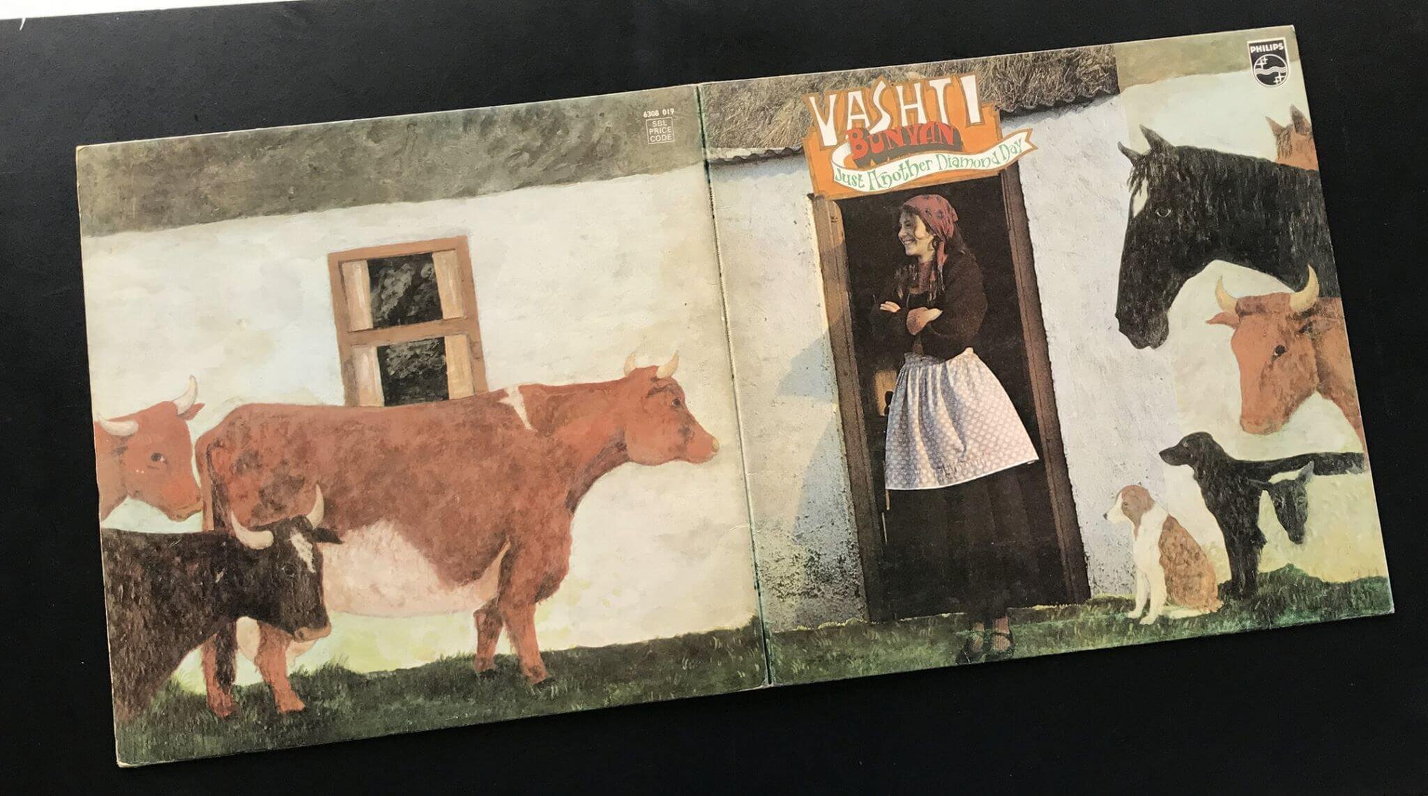 farm animals and woman on album cover (1).jpeg