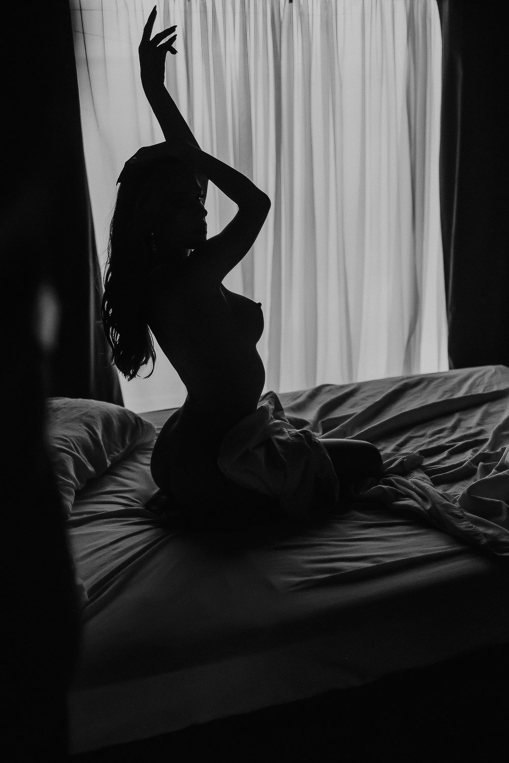 reflection photo of nude boudoir model sillouette