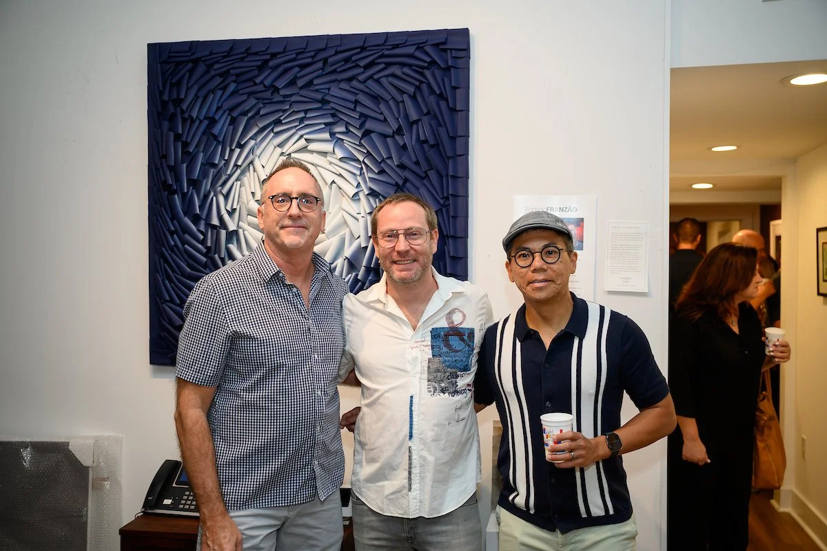 Artist Rodrigo Franzao with clients.
Photography by: Frank Aymami III