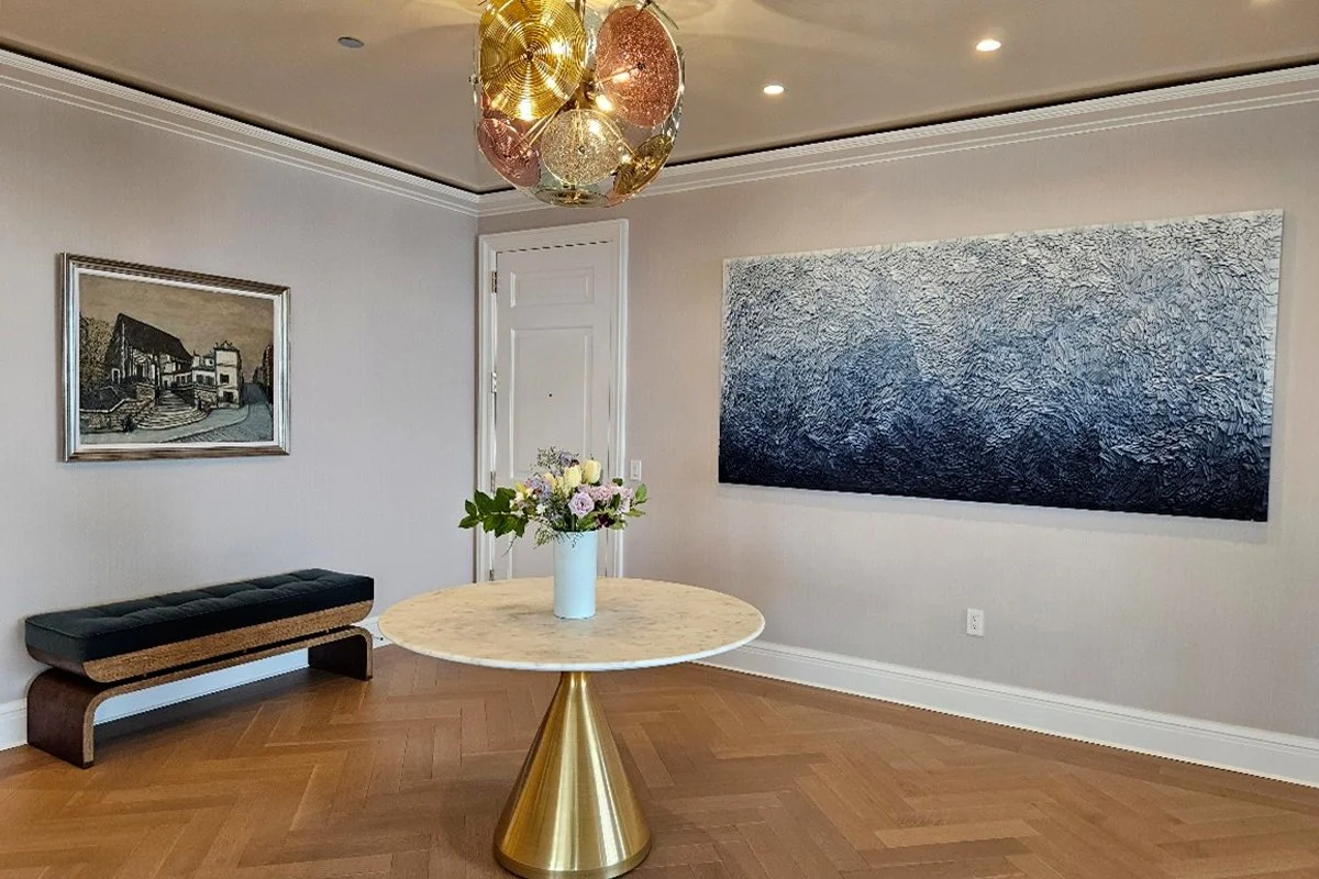 Mixed art collection showing how different paintings can coexist in one room