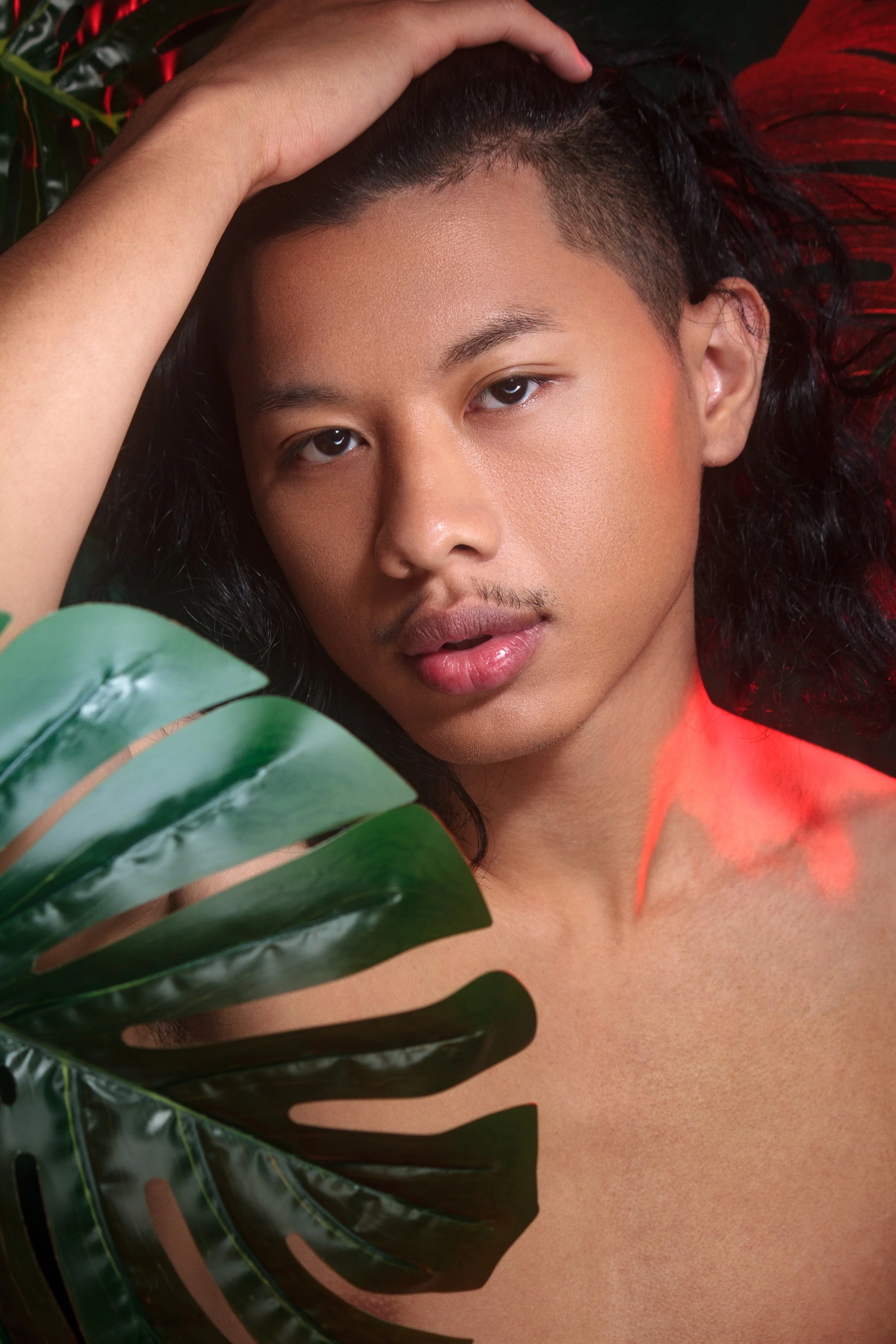 tamecka-adell-beauty-male-poing-by-plant.jpg