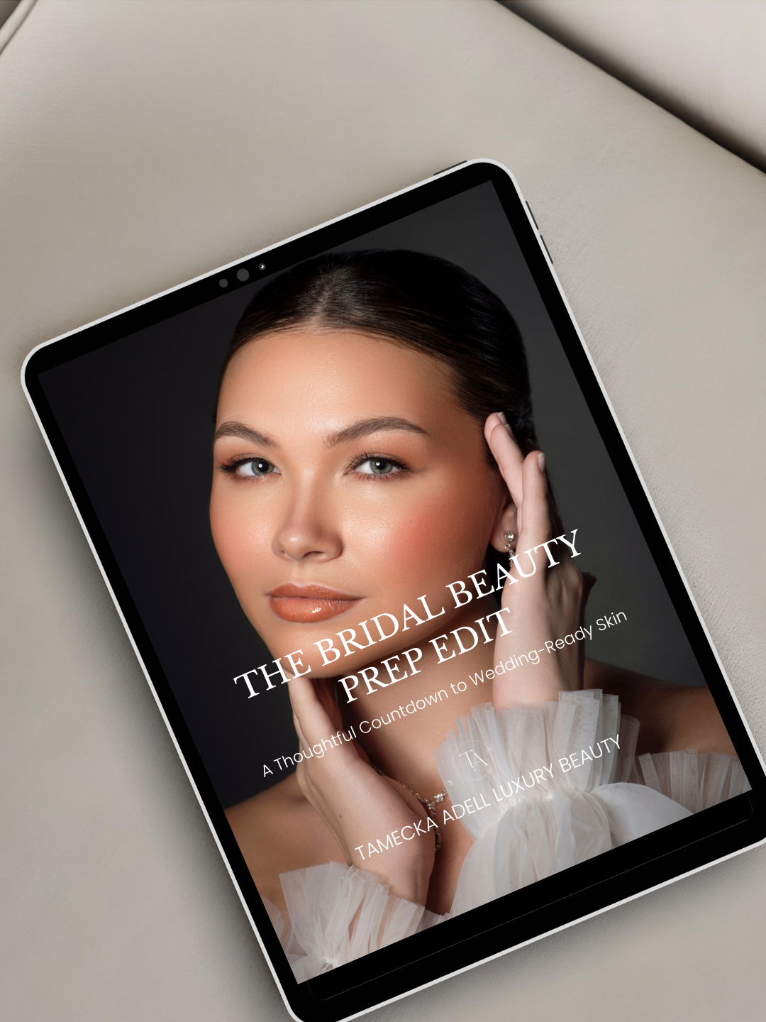 Digital cover of a beauty guide featuring a close-up of a woman with flawless makeup and bridal hairstyle, wearing pearl earrings and a tulle dress, with text about bridal beauty and wedding prep.