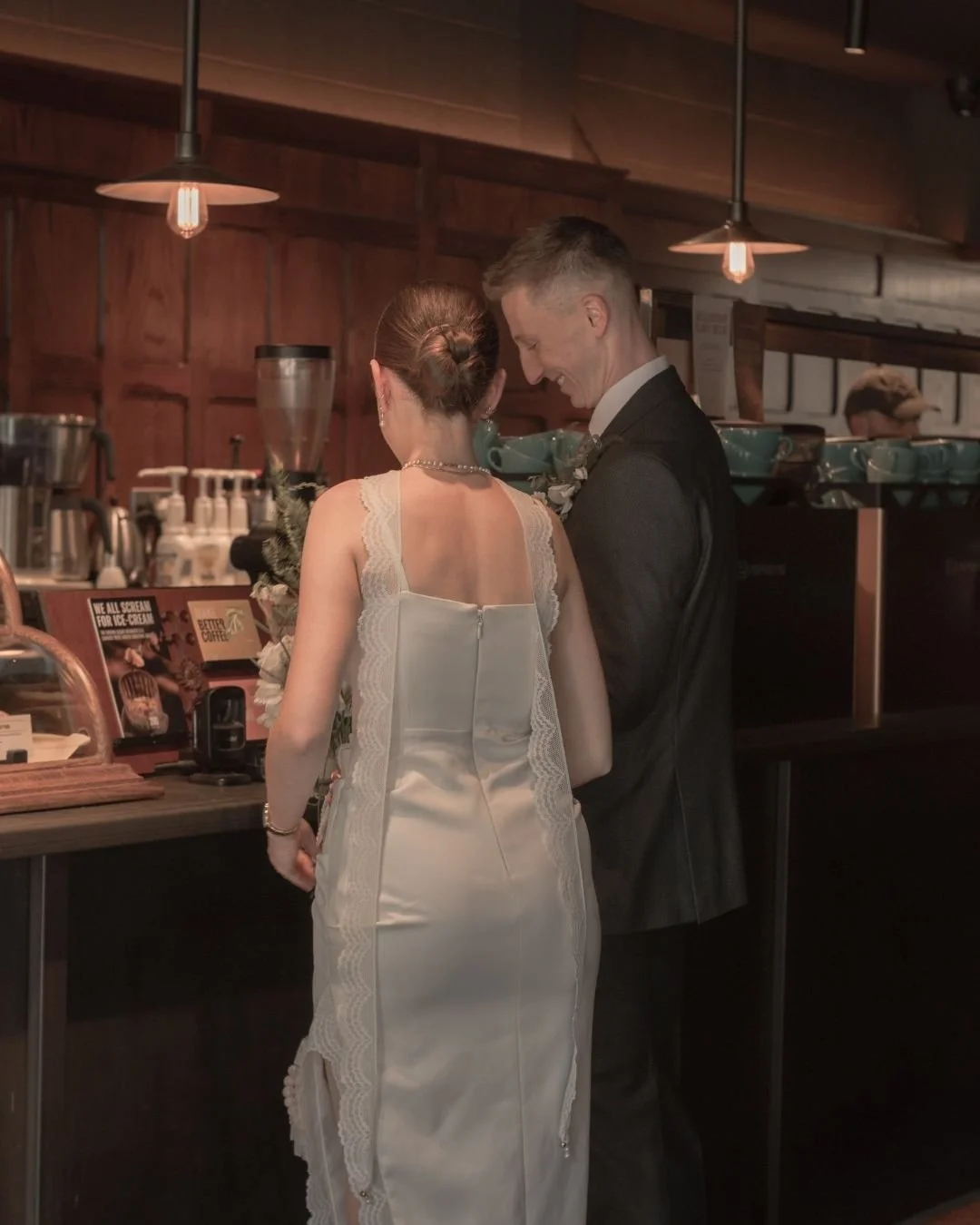 Bride and groom in West Bridgford coffee shop after getting married