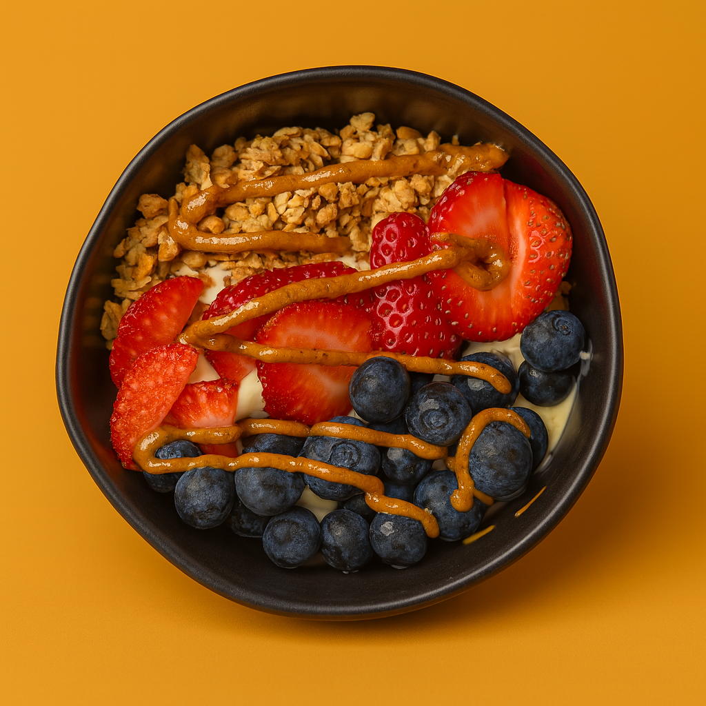 Classic Bowl: Honey Greek Yogurt, Granola, Strawberries, Blueberries, & Almond Butter Drizzle.
