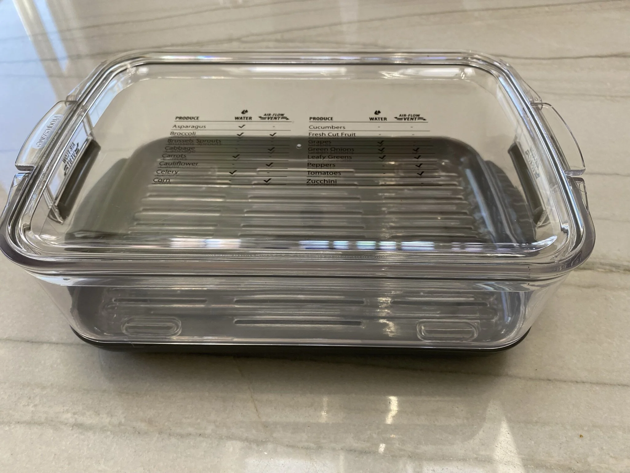 A produce container that allows for air vents to be opened or closed and water to be added to the bottom of the container, depending on your veg/fruit's needs