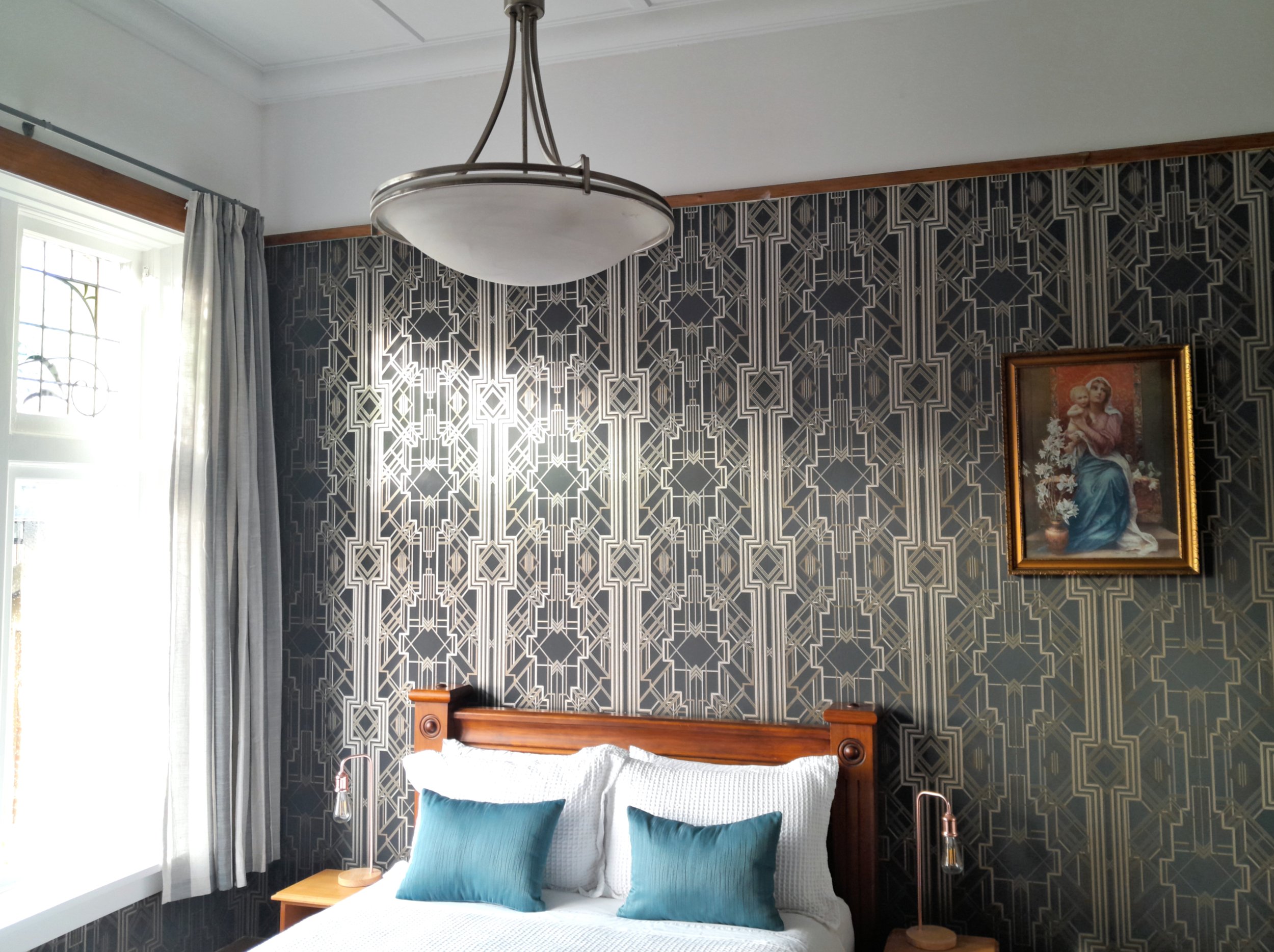 Superior boutique room at Noah's Ark Flashpacker featuring stylish wooden queen size bed.