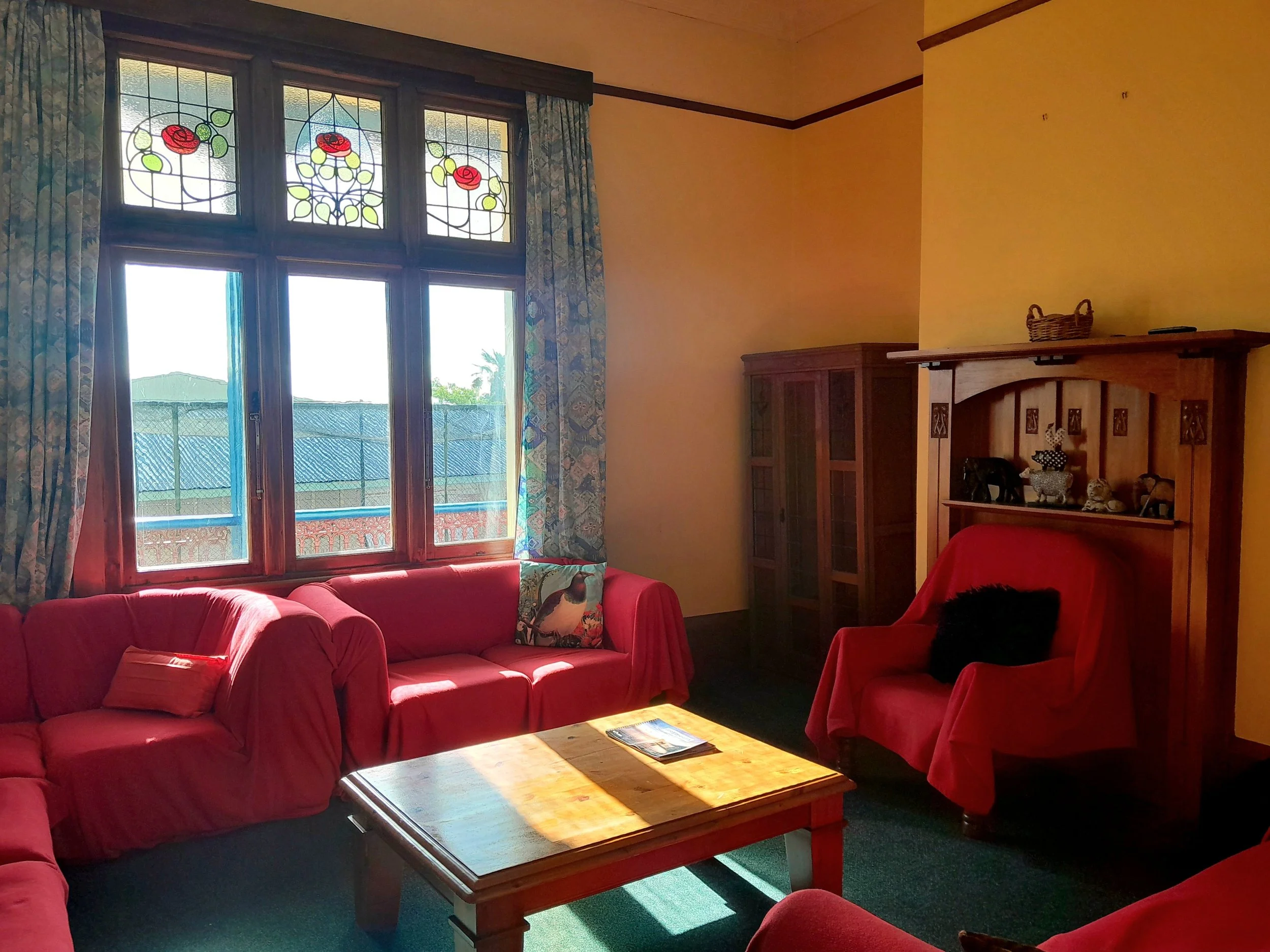 Stylish flashpacker TV room with a smart Samsung TV for a cozy stay in Greymouth, West Coast, New Zealand.