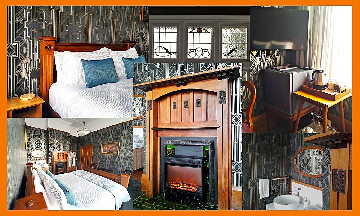 Boutique-style room at Noah's Ark with wooden queen size bed, extra pillows, electric fireplace and vintage furnishings. Large stained glass windows, TV and tea/coffee station