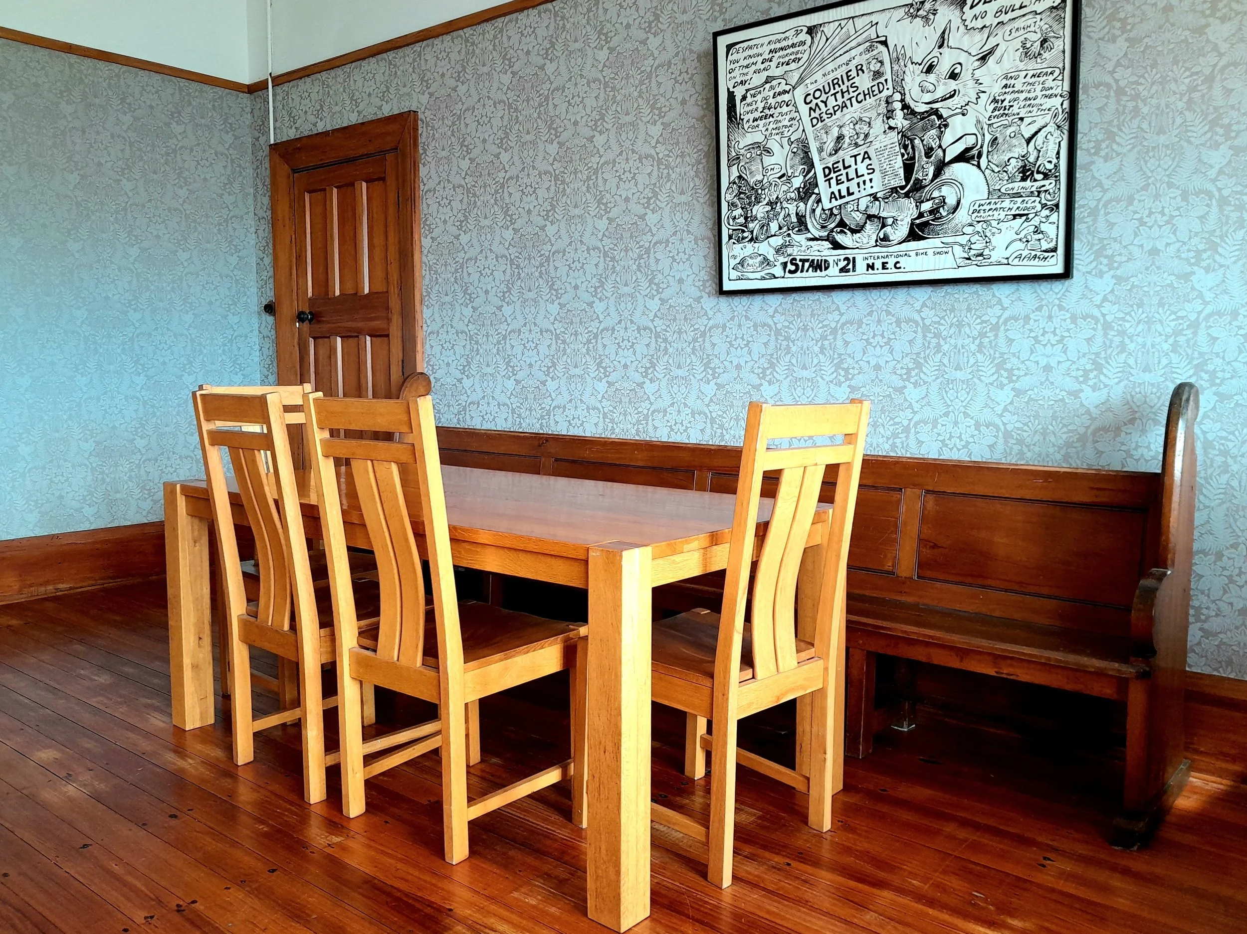 Renovated dining room at Noah's Ark flashpacker with quality wooden furniture to enjoy meals together.