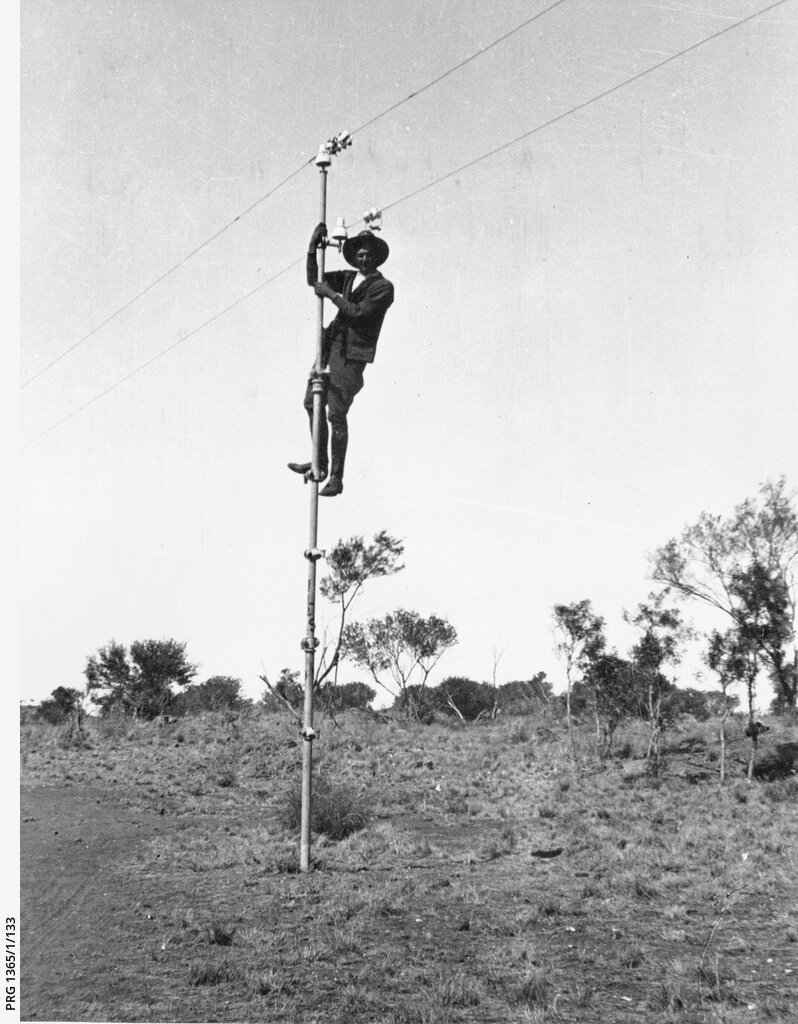 Photo 5) Bob Carew up a pole of the Overland Telegraph Line.
