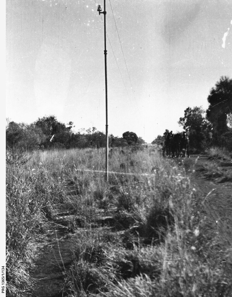 Photo 6) A view of the overland telegraph line.