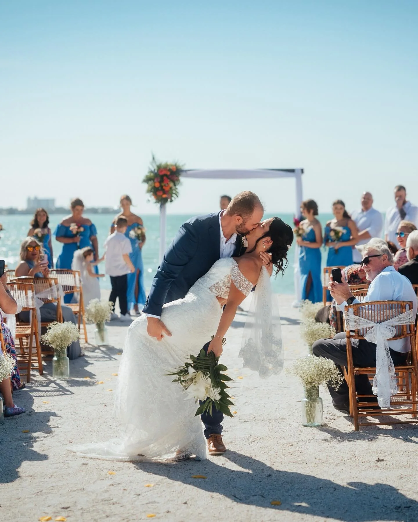 Beach wedding season! Some favorite moments from Gina and Jake&rsquo;s beautiful Lido Beach wedding and reception at @gilligansbar 🏝️ 

#beachwedding #sarasotaweddingphotographer #miweddingphotographer #ashevilleweddingphotographer #flweddingphotogr
