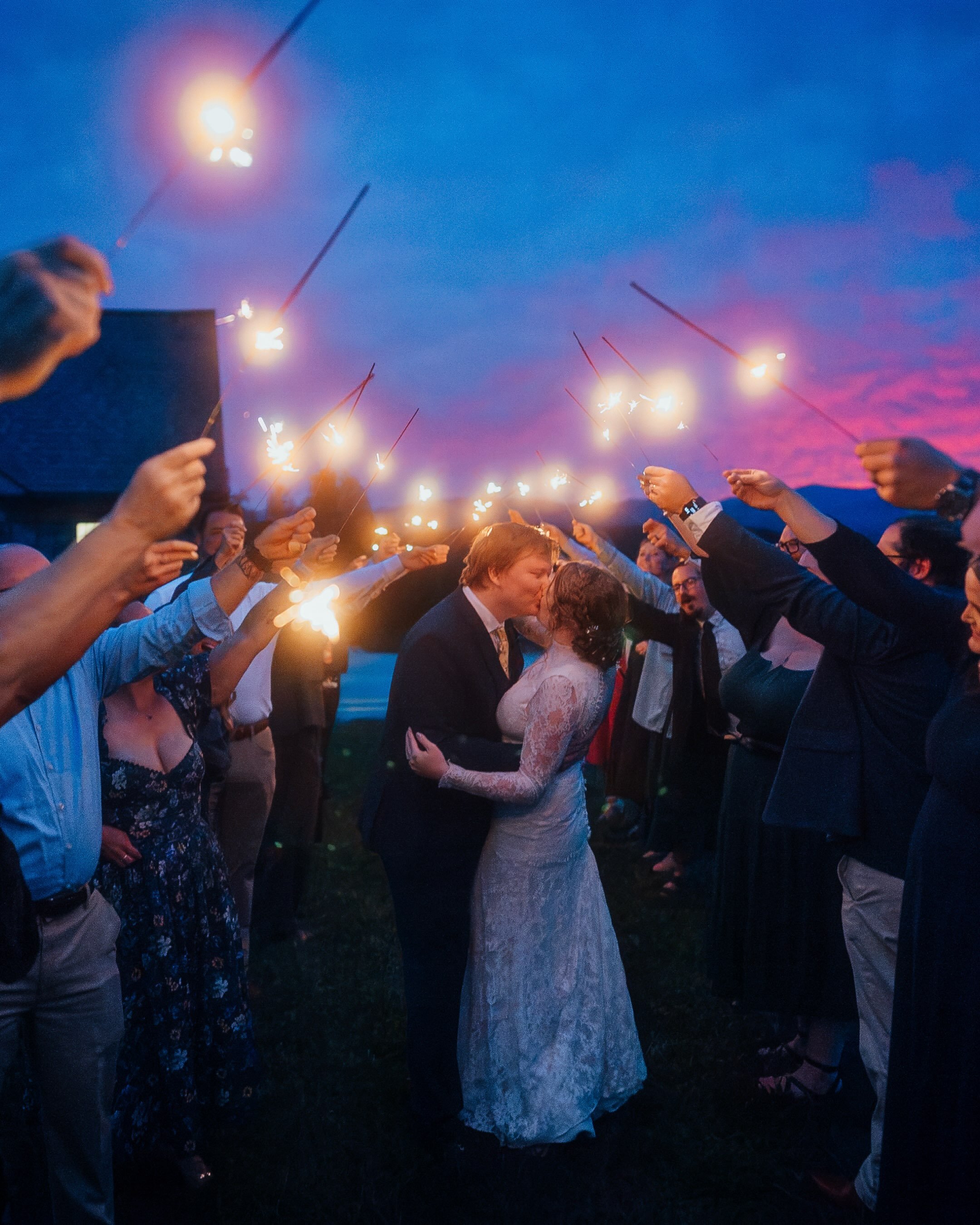 You can plan a sparkler exit, but you definitely can&rsquo;t plan a sky like this. Congrats to Carolyn and Aidan!! 🎉🌅⛰️

@somethingbluemountain | Marion, NC

#MarionNCWedding #NorthCarolinaWedding #NCWeddingPhotographer #flweddingphotographer