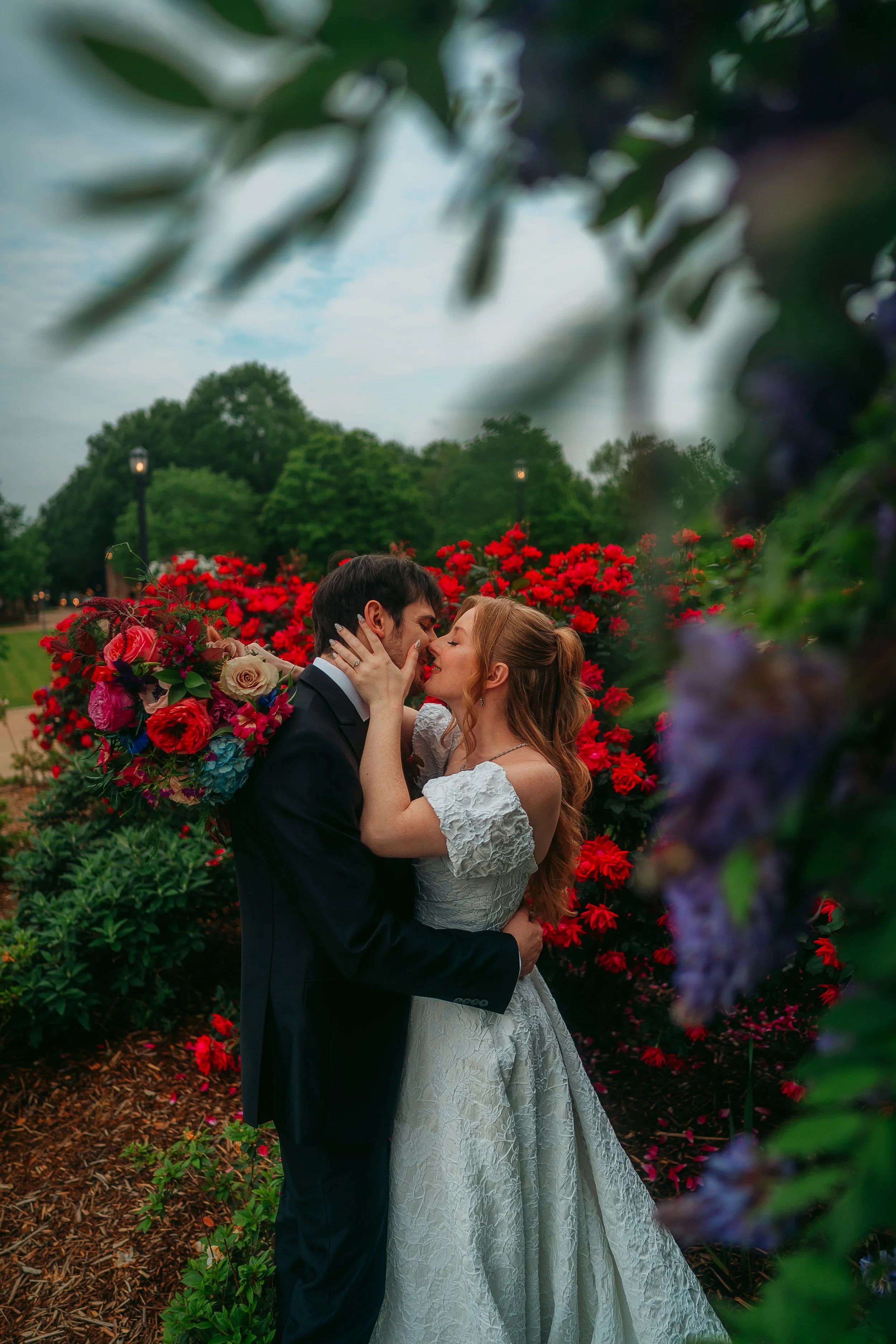 Newly married couple kissing at Edinburgh West wedding venue, Taylors, SC.