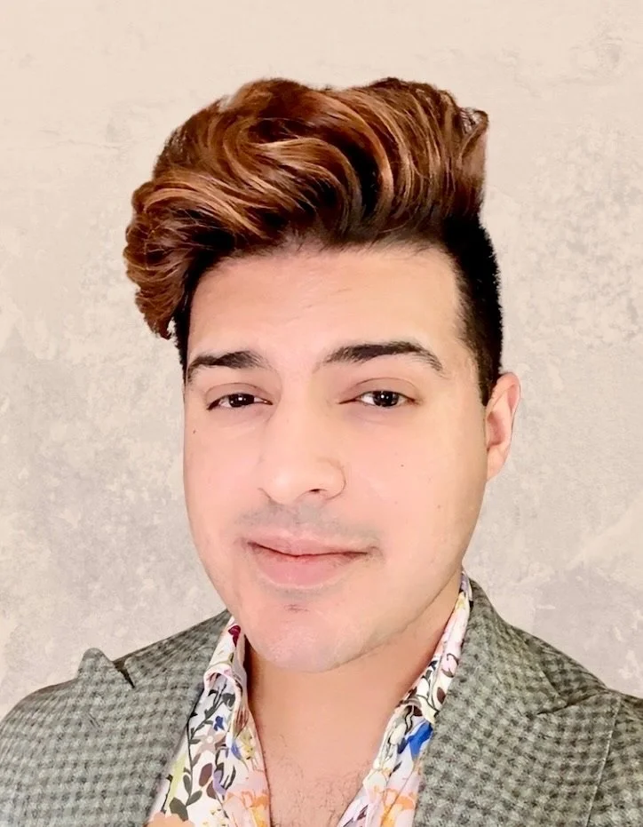Portrait of Mr. Shiv Bhanot, smiling with neutral background