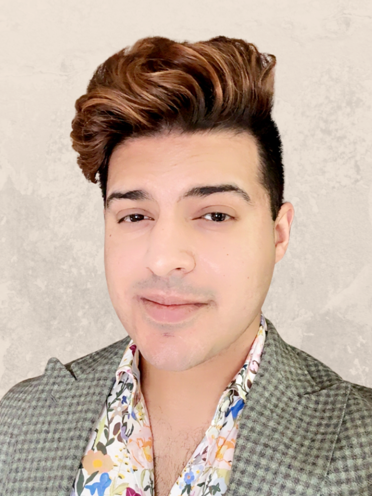 Portrait of Mr. Shiv Bhanot, smiling with neutral background