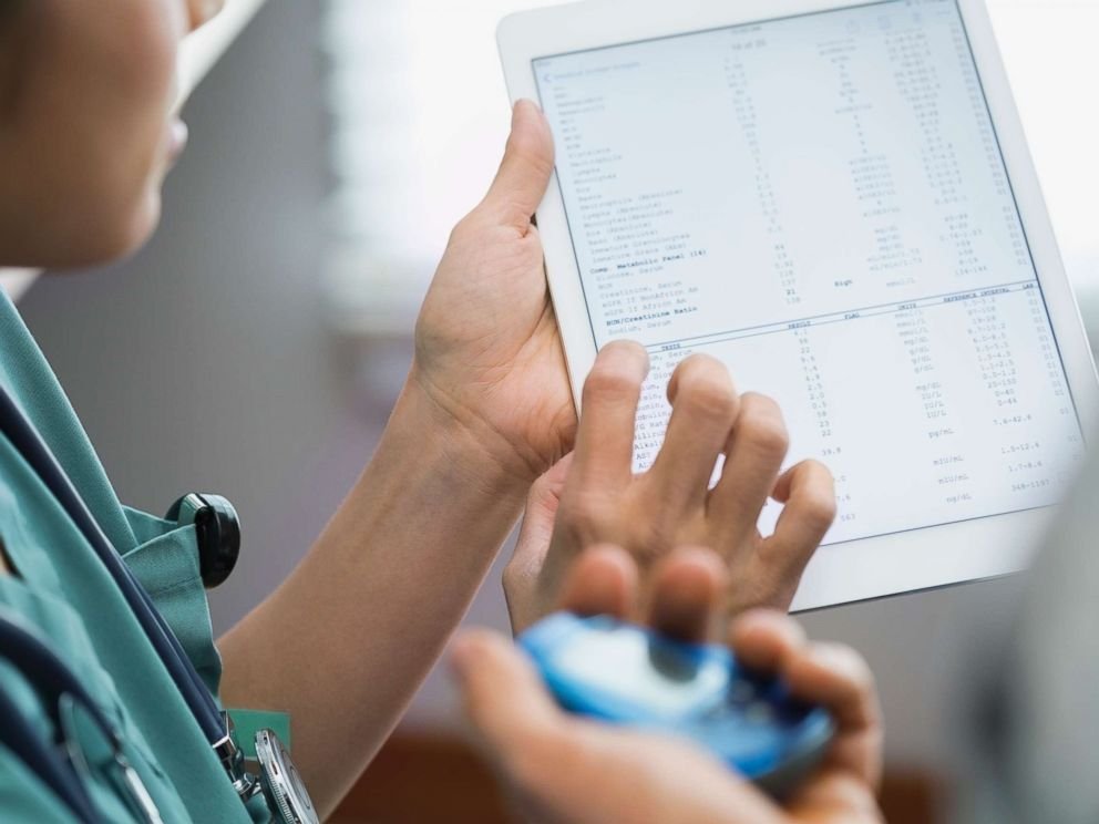 Medical provider viewing medical data on a tablet