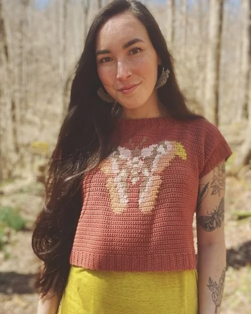 Jenn Cody of Sunflower Knots in a rust crochet tee with a pale moth design