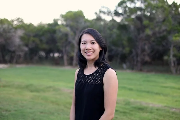 Andrea Lui of Aylooknits in a black sleeveless knit top with a lace yoke outdoors