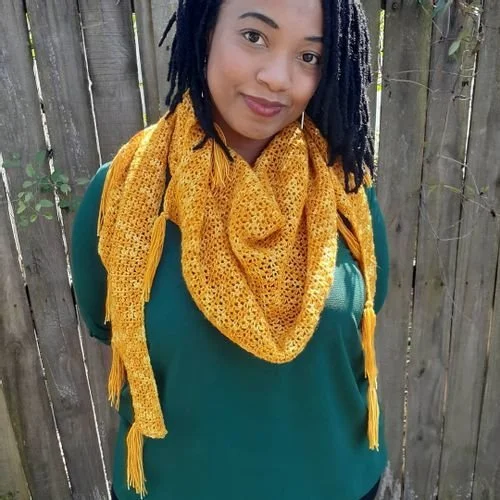 Tina Smith in a mustard lacy triangle shawl with tasseled ends