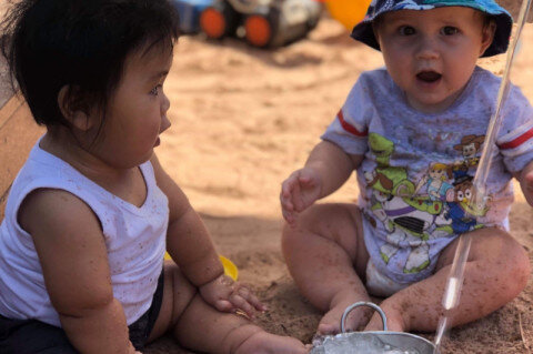 babies playing in sand.jpg