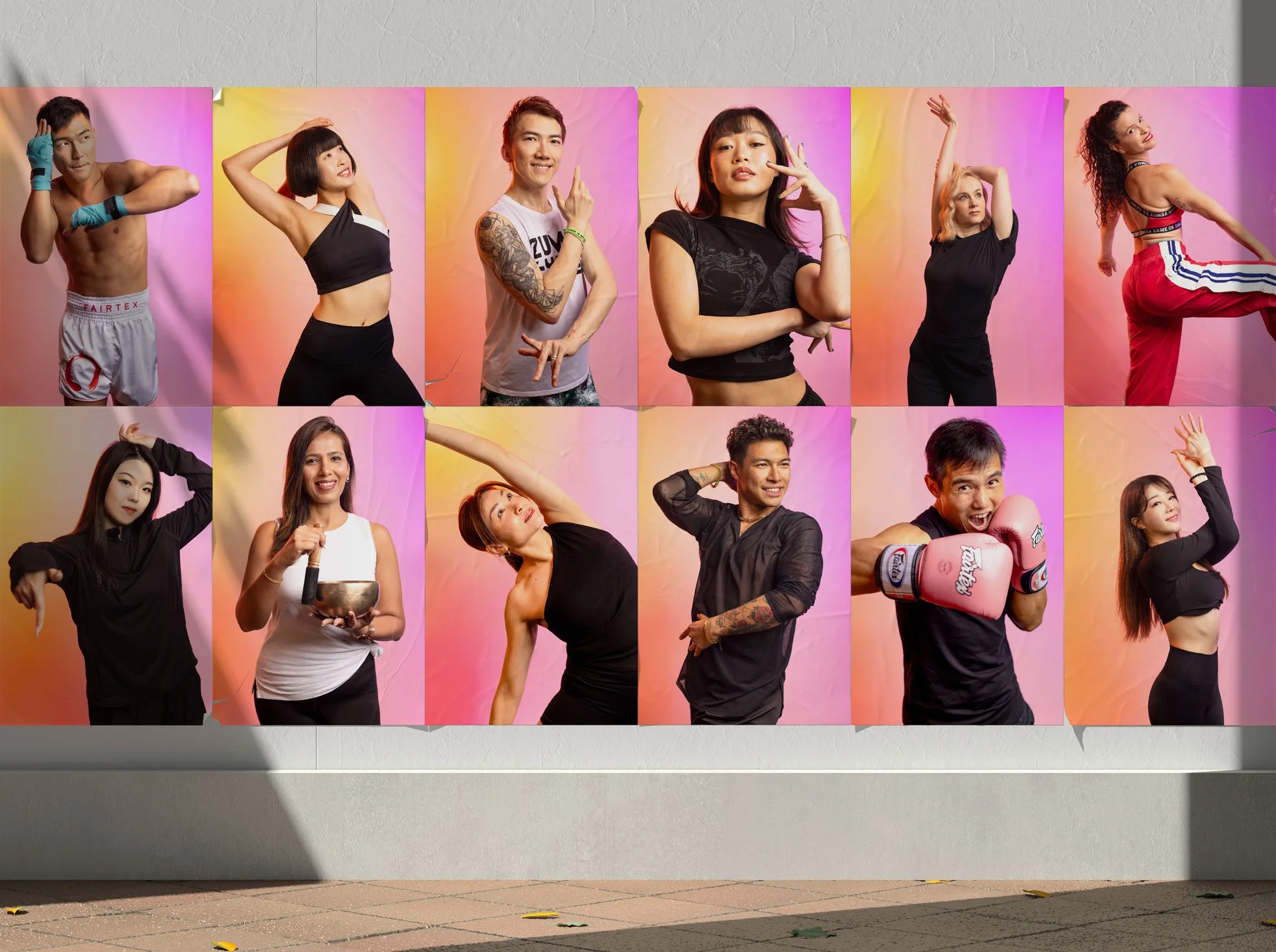 A large group of diverse people in athletic or dance poses, standing against a colorful background of pink, yellow, and orange hues.