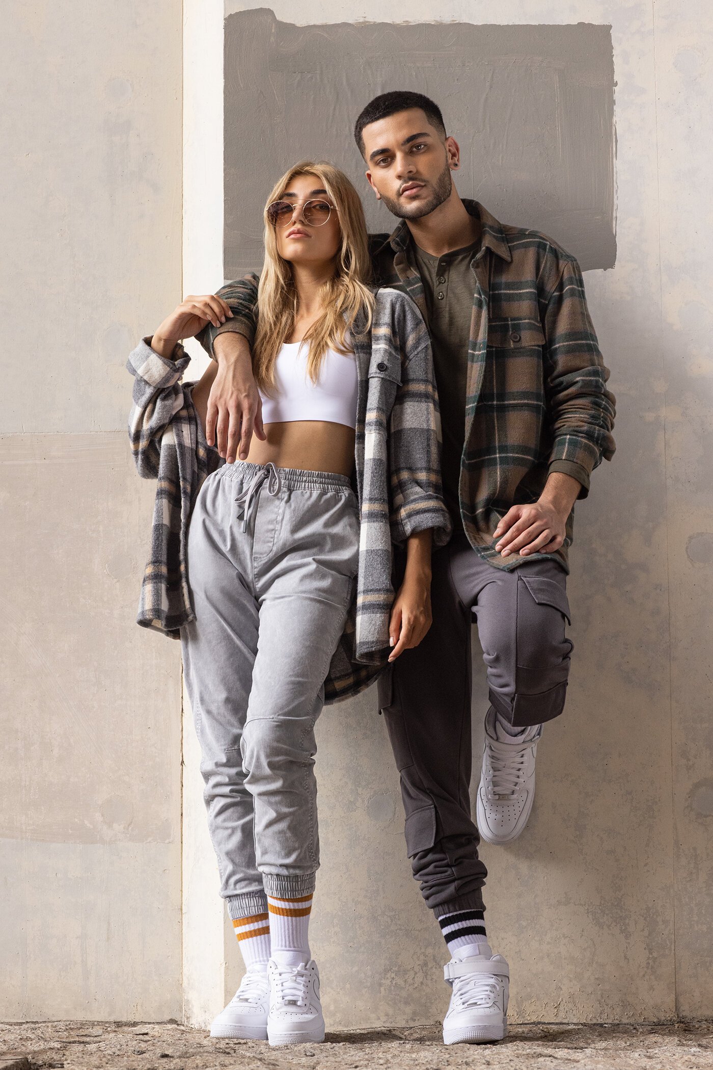 young couple tracksuit check shirt flannel urban cool diverse models mediam rare sneaker white airforce one.jpg