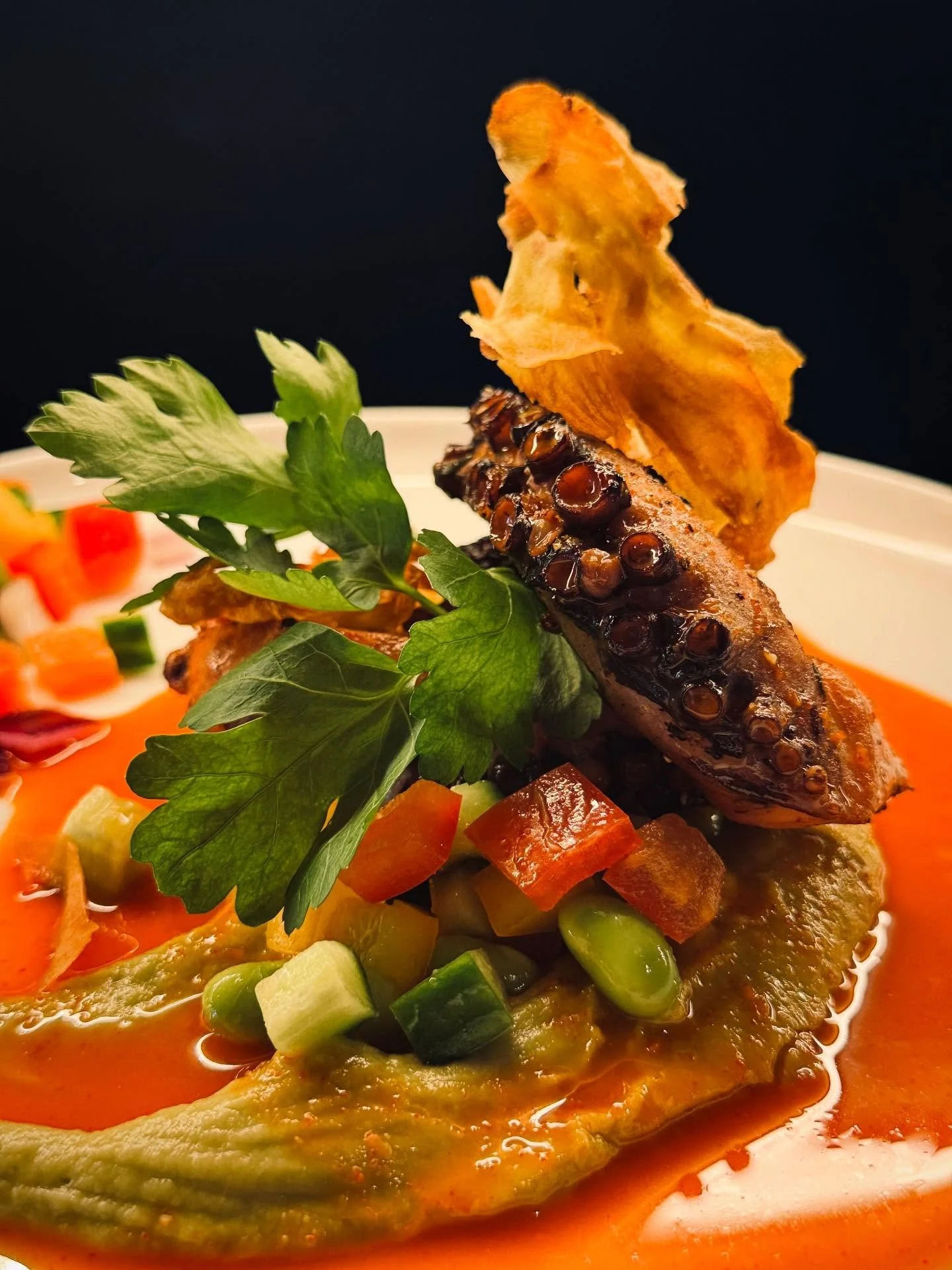 Tender octopus, kissed by the grill for a smoky depth, paired with a bright and zesty fresh salsa. A touch of Korean chilli dressing adds just the right balance of heat and vibrance, lifting every bite into a bold yet refined experience. 

A true cel