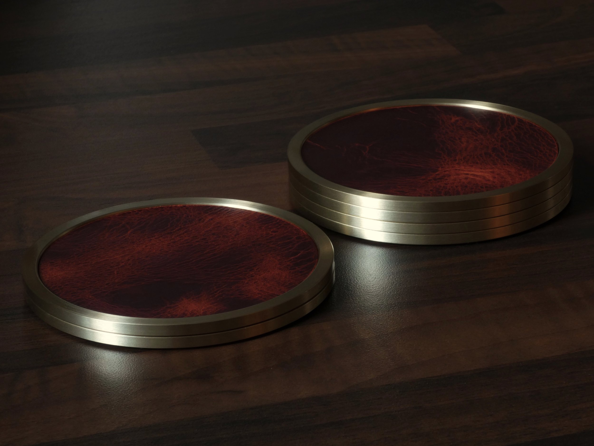 Leather and brass coasters stacked together