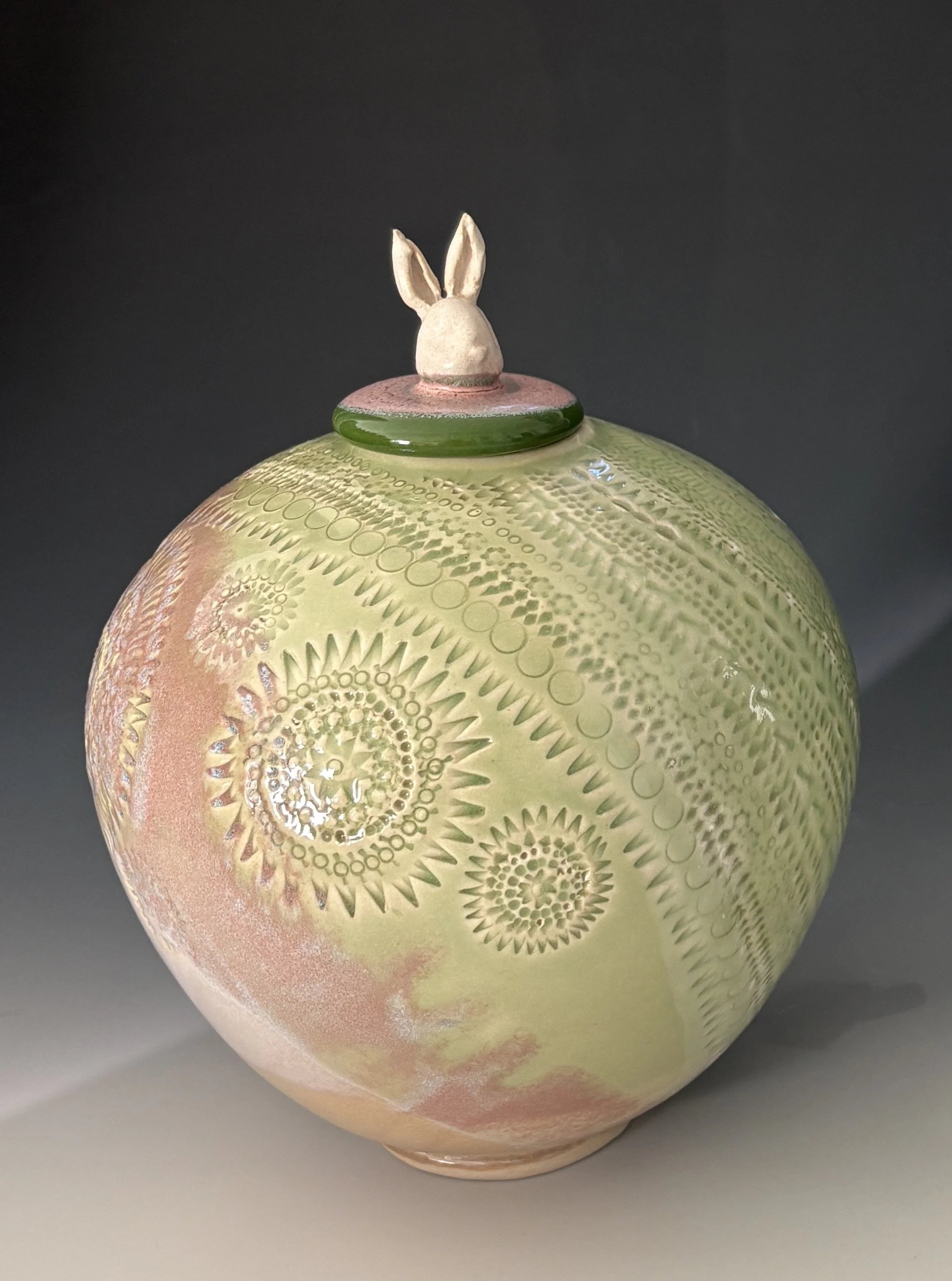 Carved vessel with rabbit head; 8" tall; $325