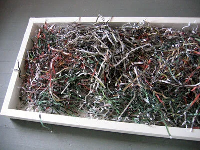 It's Safe To Open Your Eyes Now, Pt 1: Mixed Media Installation with Shredded Photos from US Army internal investigation of Abu Ghraib. [Visible Collective/Mohaiemen]