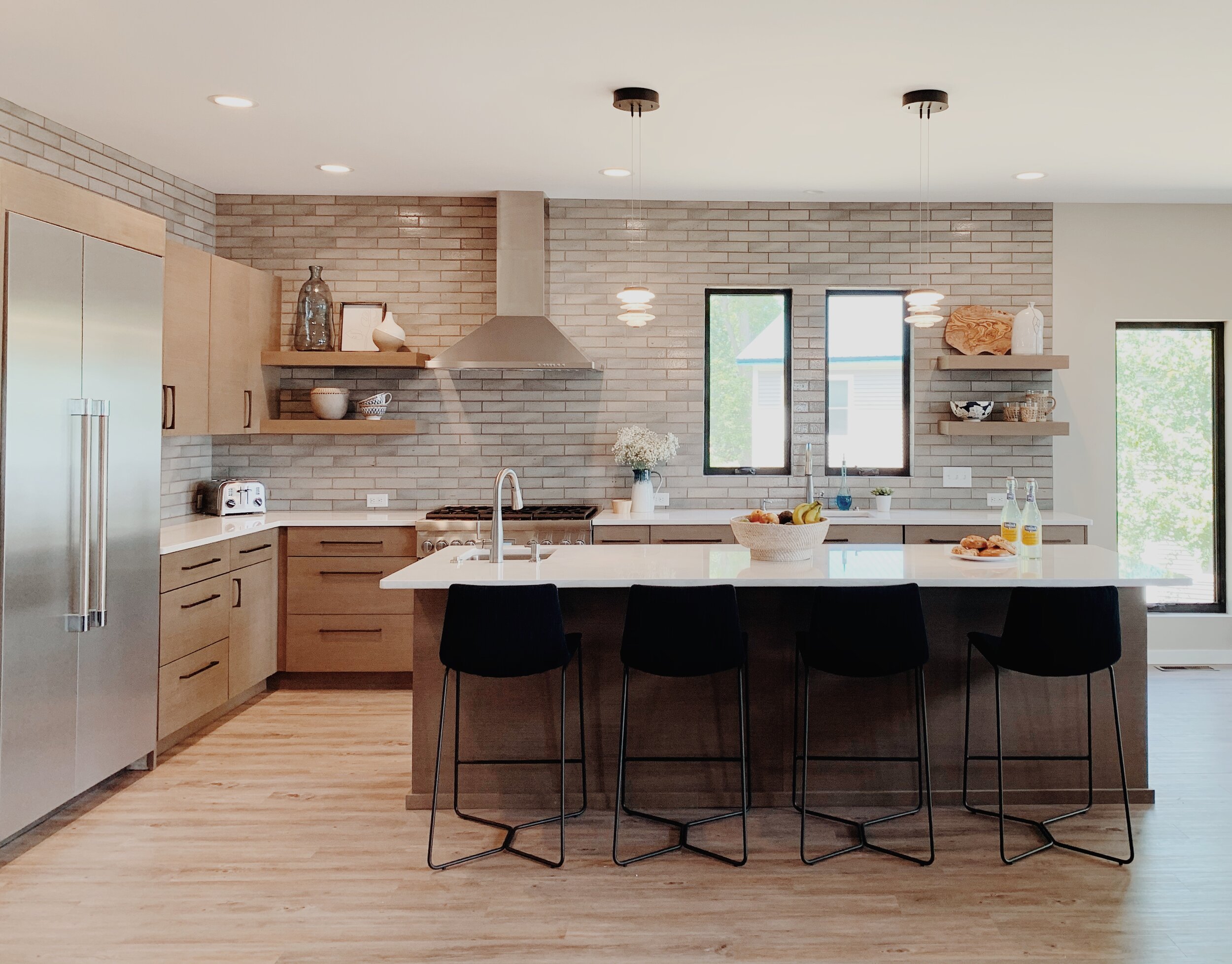  kitchen design, custom cabinets, kitchen countertops, kitchen lighting, black windows, neutral paint 