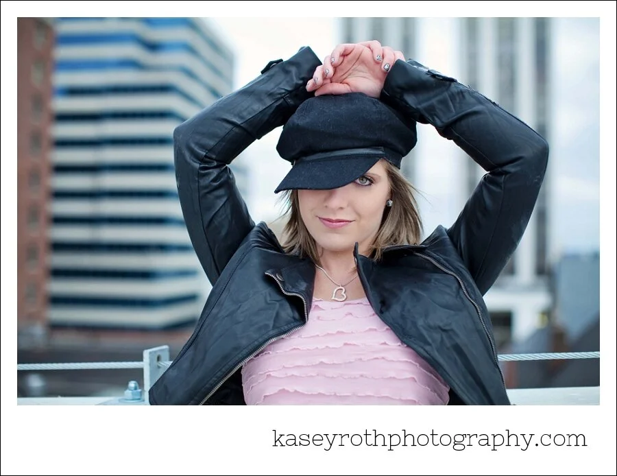 A pretty girl in a red dress & a chilly rooftop