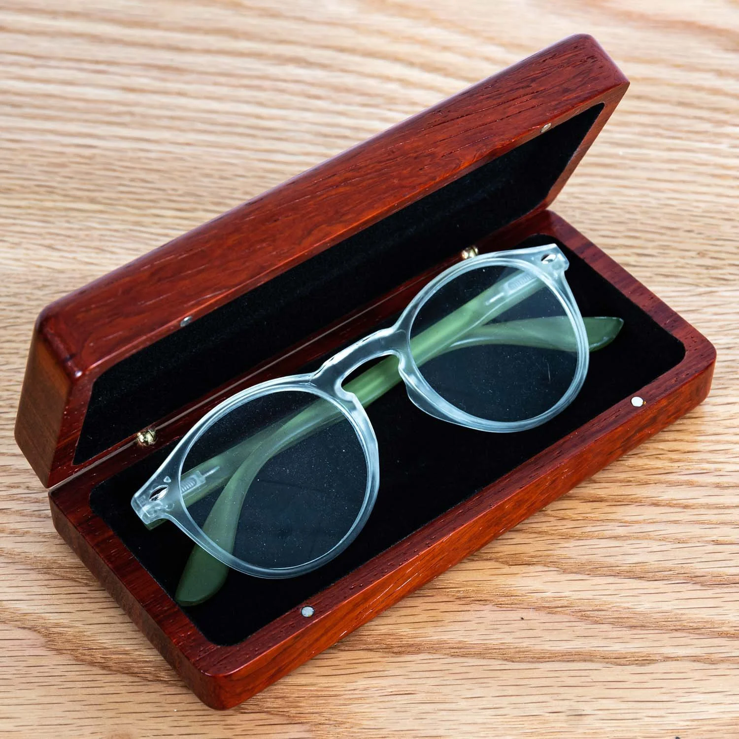 open-padauk-eyeglass-case-clear-frames-wood-table.jpg