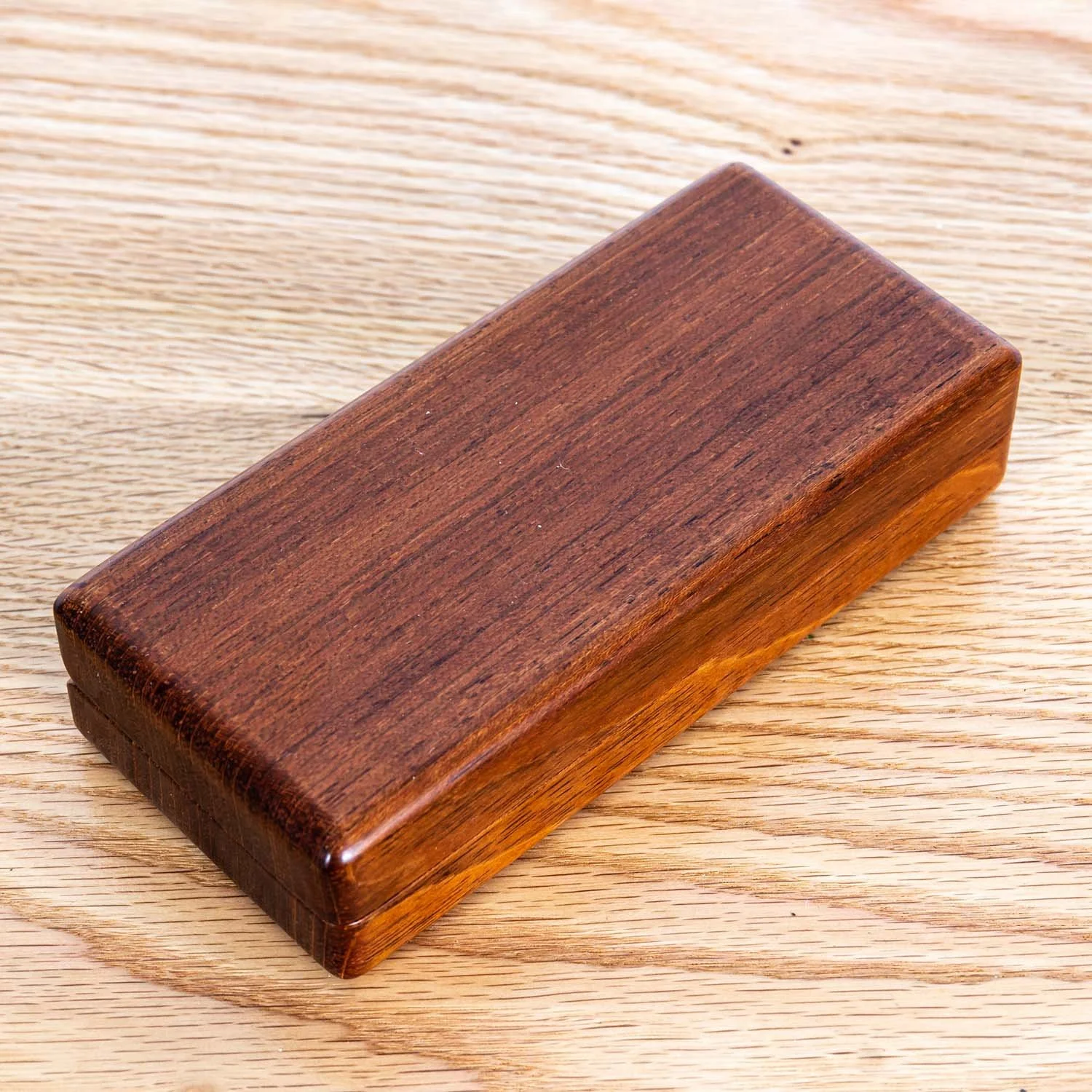 jatoba-eyeglass-case-closed-wood-surface-tweatherheadco.jpg