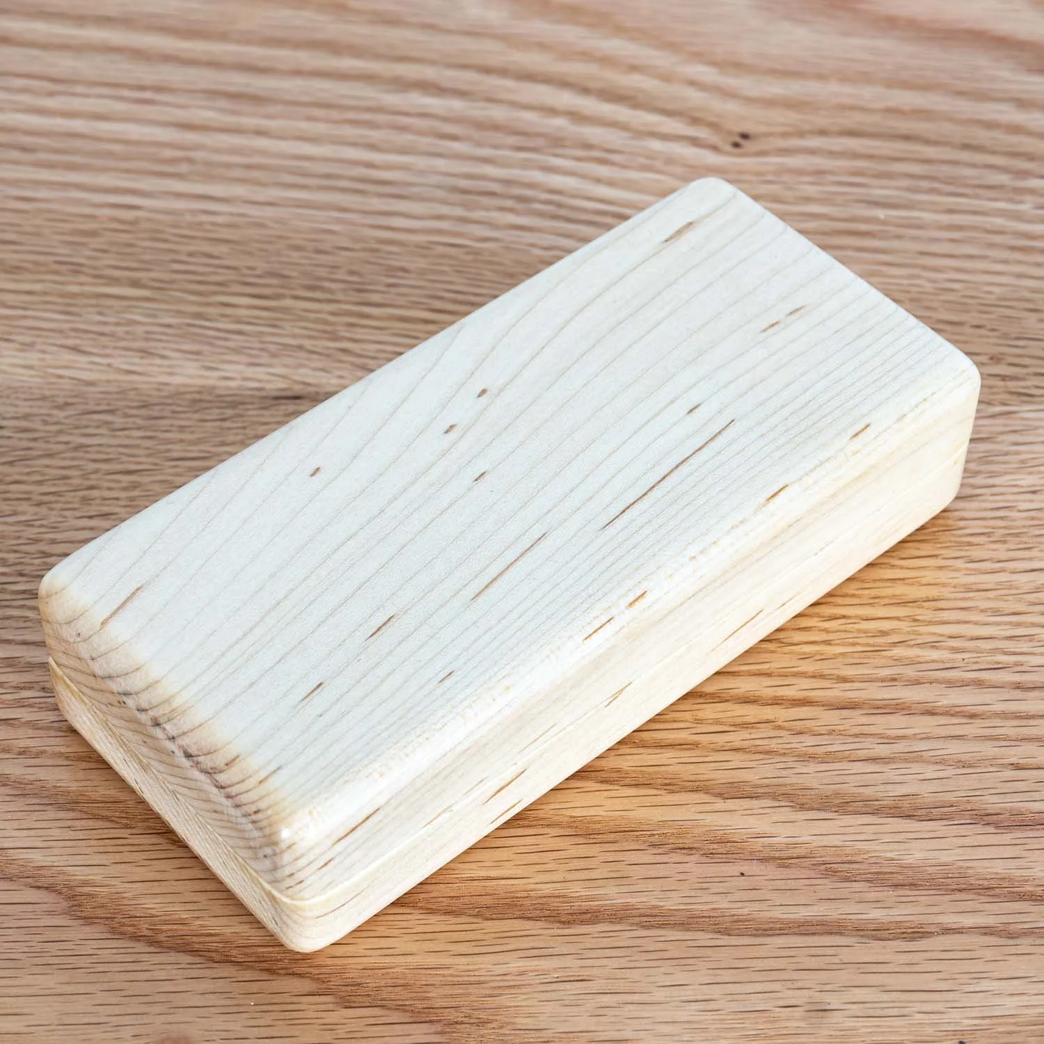 maple-eyeglass-case-closed-wood-surface-tweatherheadco.jpg