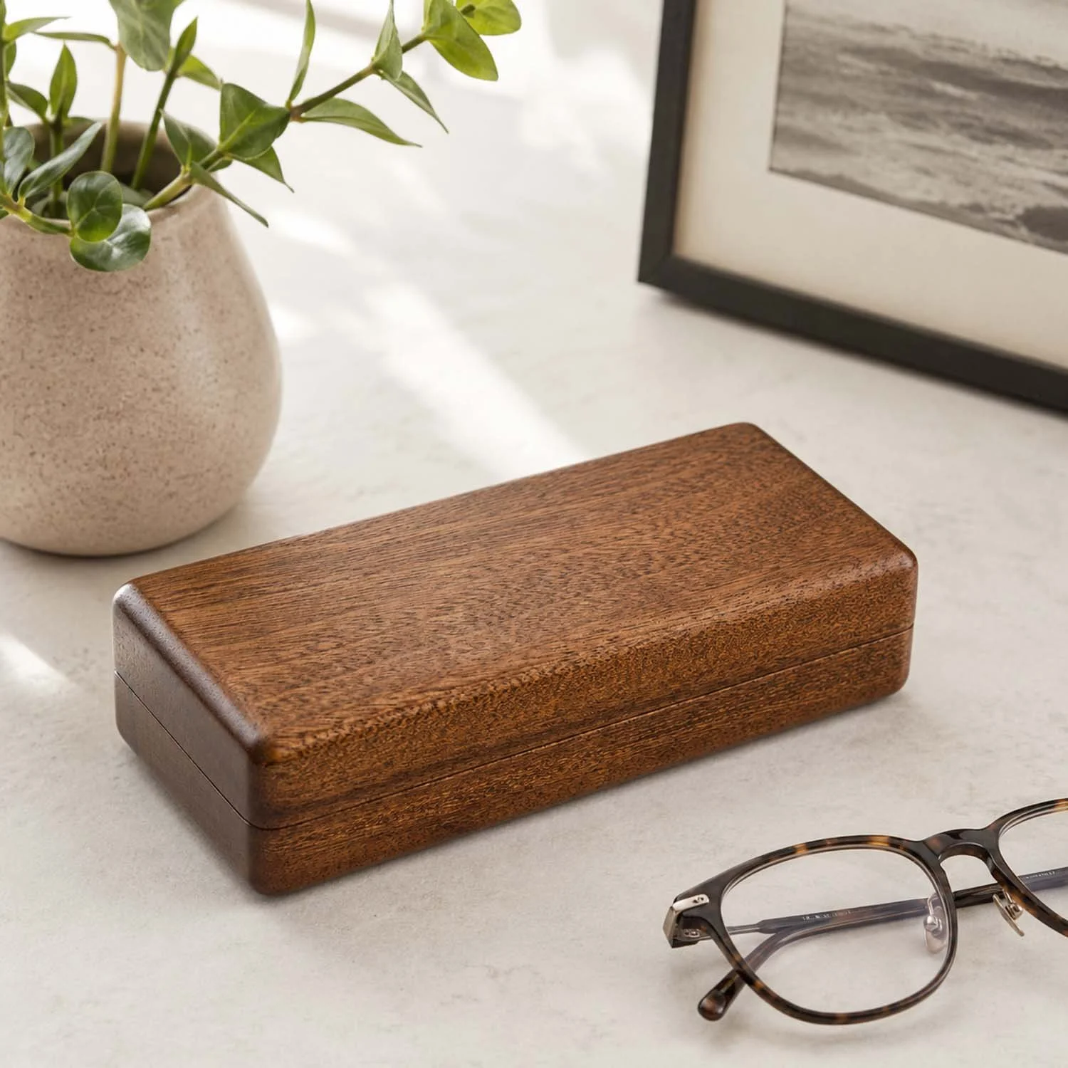 sapele-eyeglass-case-lifestyle-stone-surface-closed.jpg