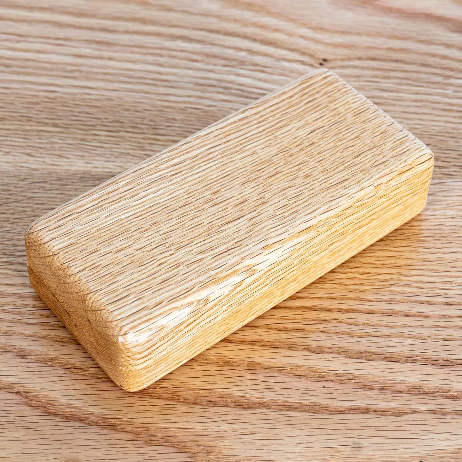 oak-eyeglass-case-closed-on-wood-surface.jpg