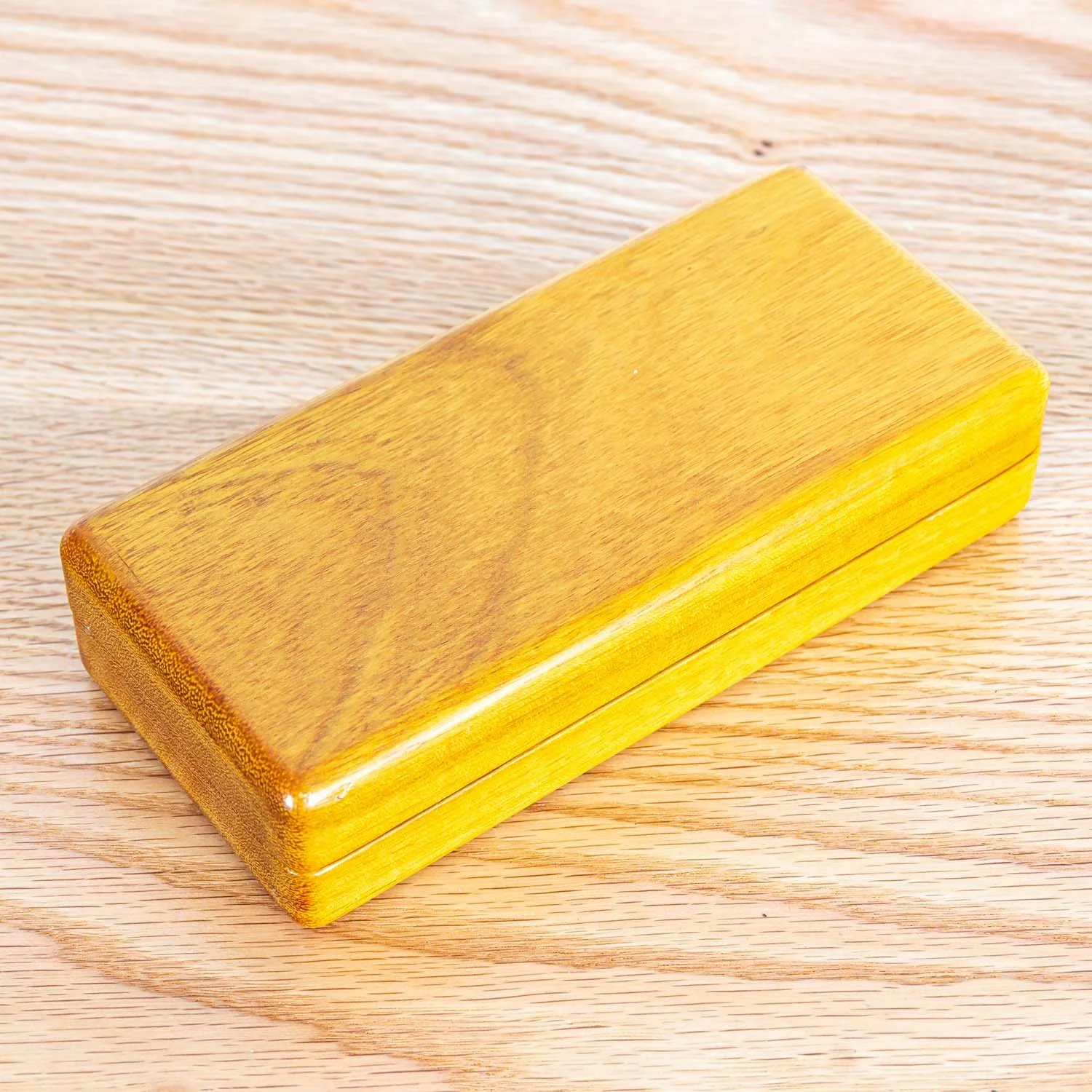 osage-orange-eyeglass-case-closed-wood-surface.jpg