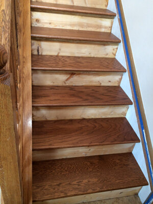 stairs with new treads installed and stained