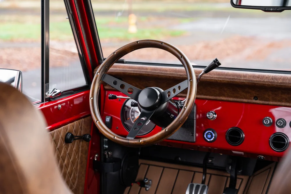 Grant wood and black steering wheel