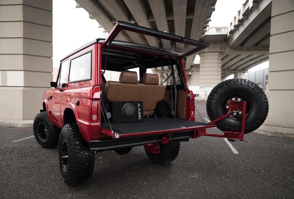 Tire carrier open for rear access