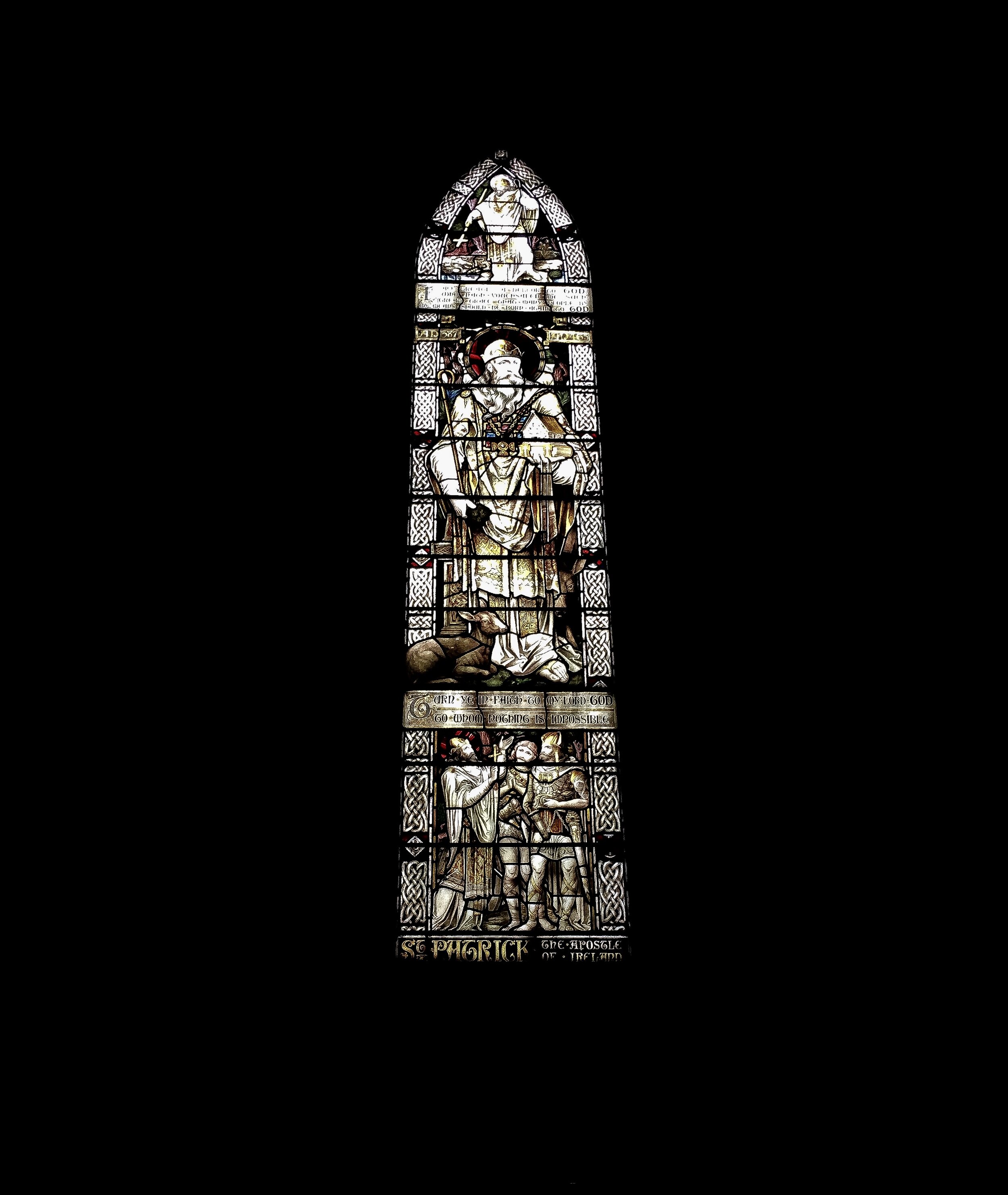 Dramatic photograph of stained glass from inside St. Patrick's Cathedral located in Dublin, Ireland.