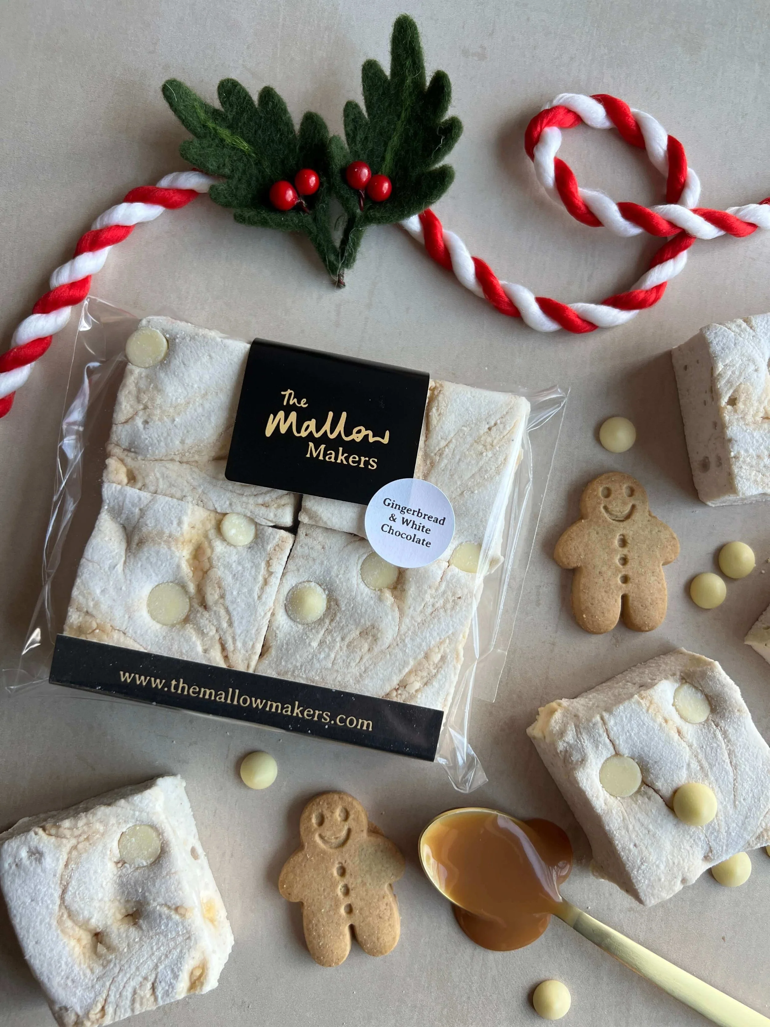 looking-down-on-ginger-and-white-chocolate-marshmallows-with-ingredients-scattered-and christmas-ribbon.jpeg