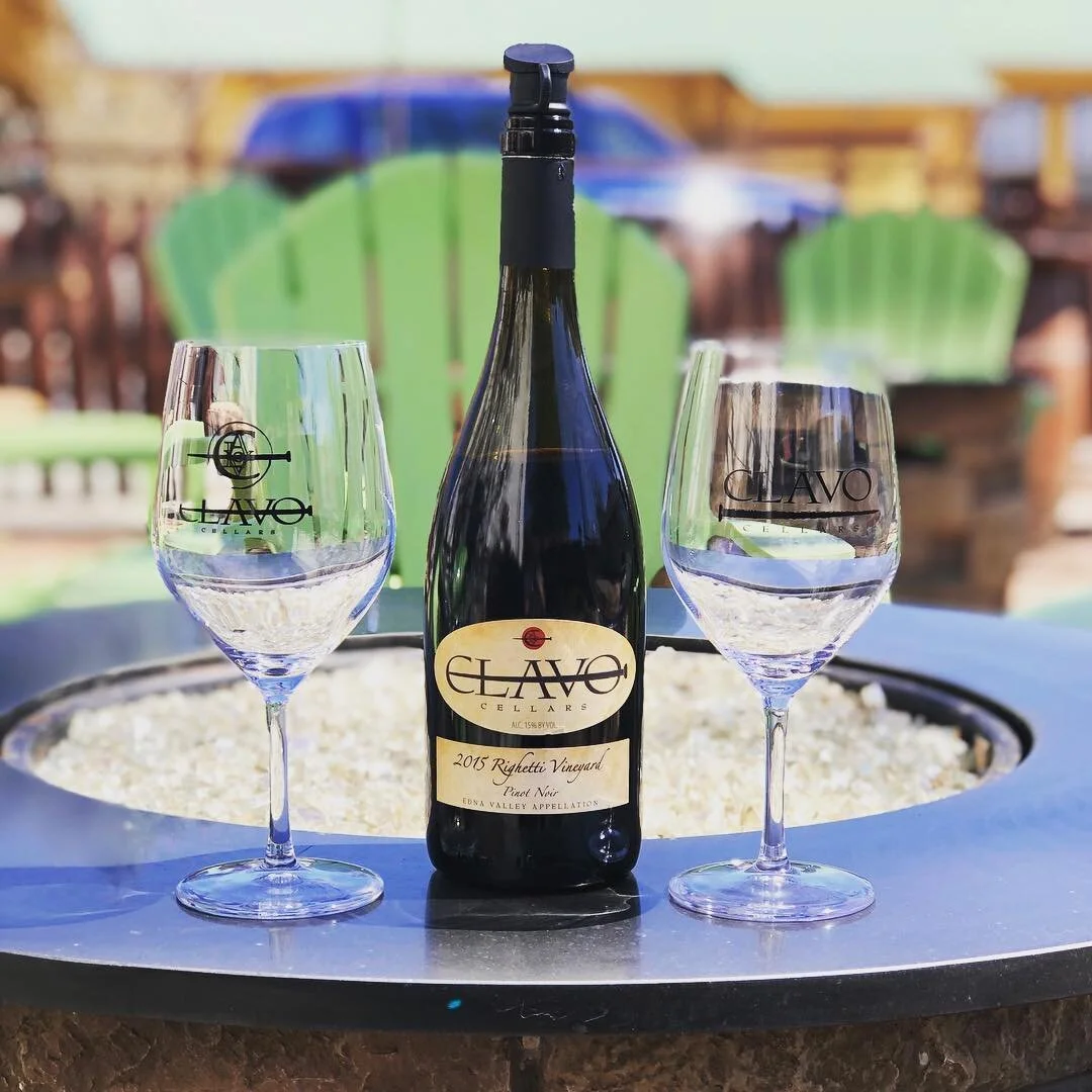 Bottle of Clavo Cellars wine with two glasses