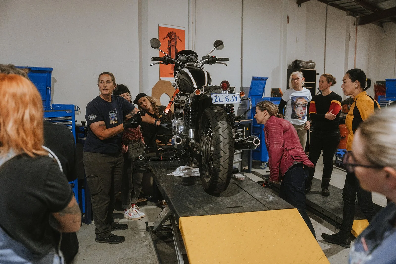 Pushing miles machine alley womens servicing workshop melbourne content creator photographer moto ugc