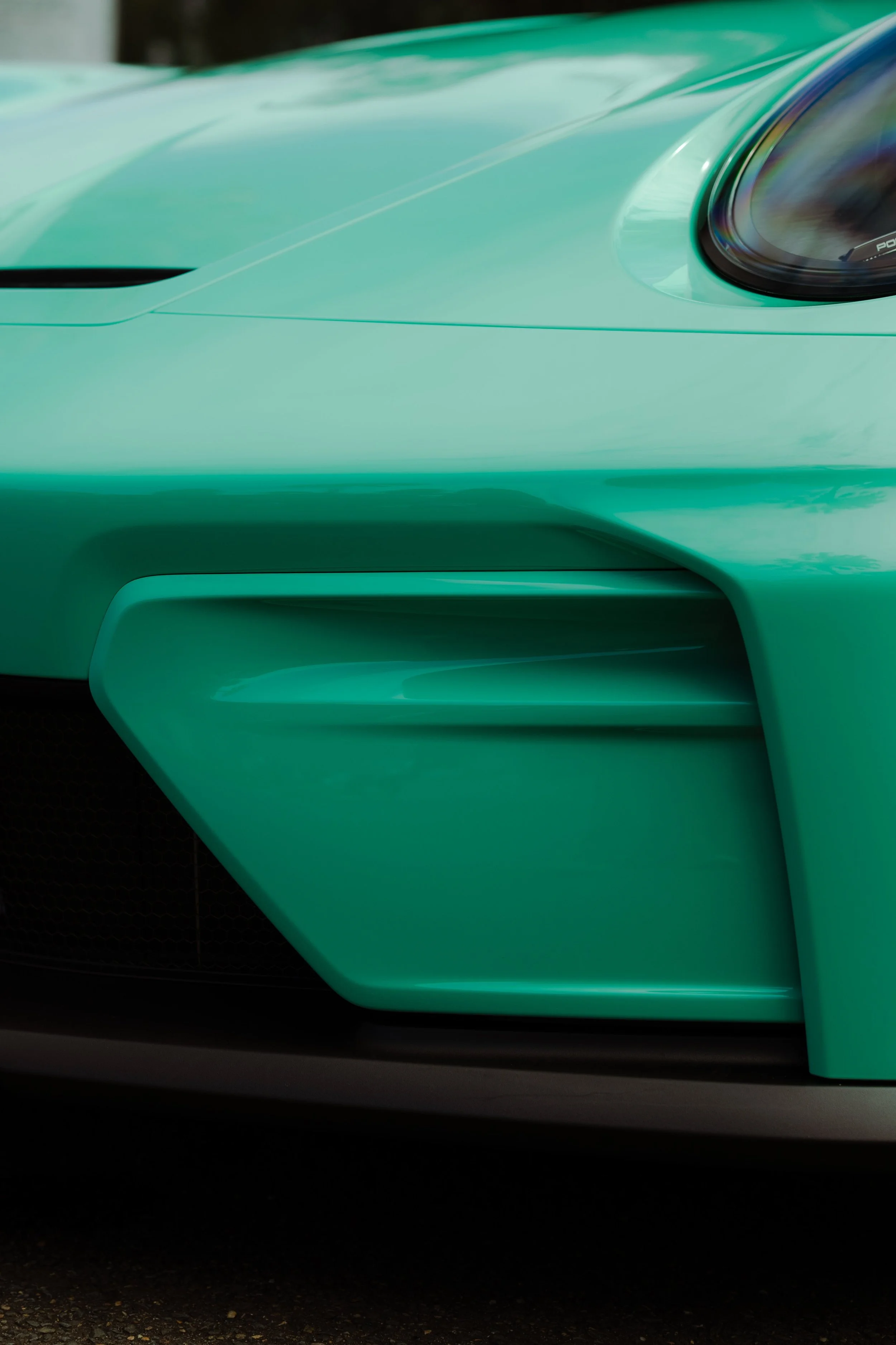 Mint green Porsche 911 GT3 front bumper air intake and headlight with XPEL Paint Protection Film in Sydney